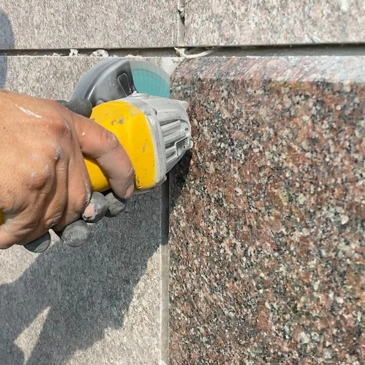 Granite to Granite 1 inch -1 1/2 inch control joints cut out existing  eurathane sealant grind and repack and replace with spec. 1 .