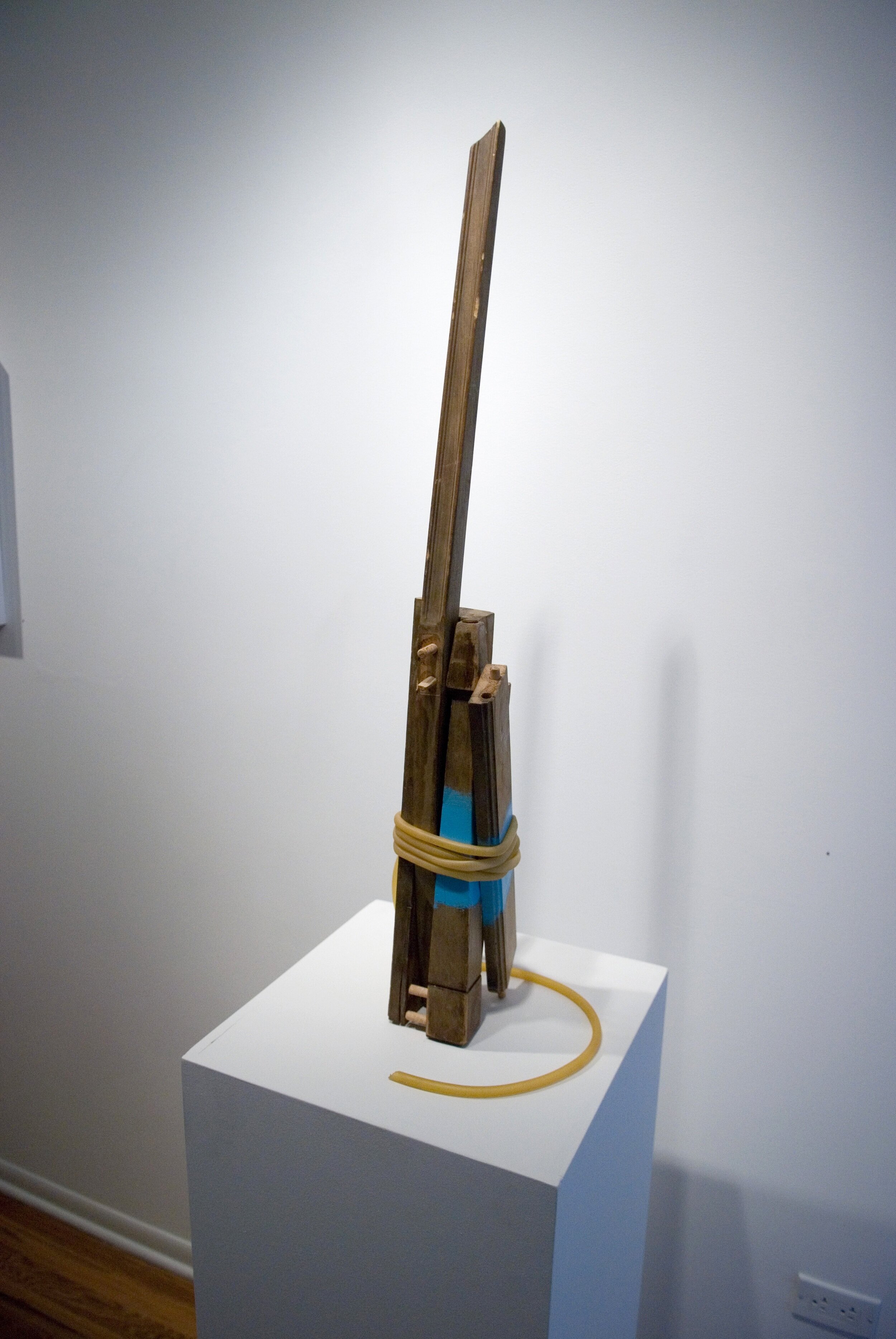 Sled/Leavetaking, 2007. Discarded wood, acrylic and rubber tubing, 42 x 8 x 12 in.