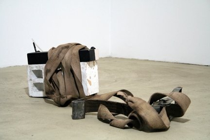 Sinker, 2010. Concrete, player piano roll, cardboard, rubber tubing and rachet, dimensions variable.