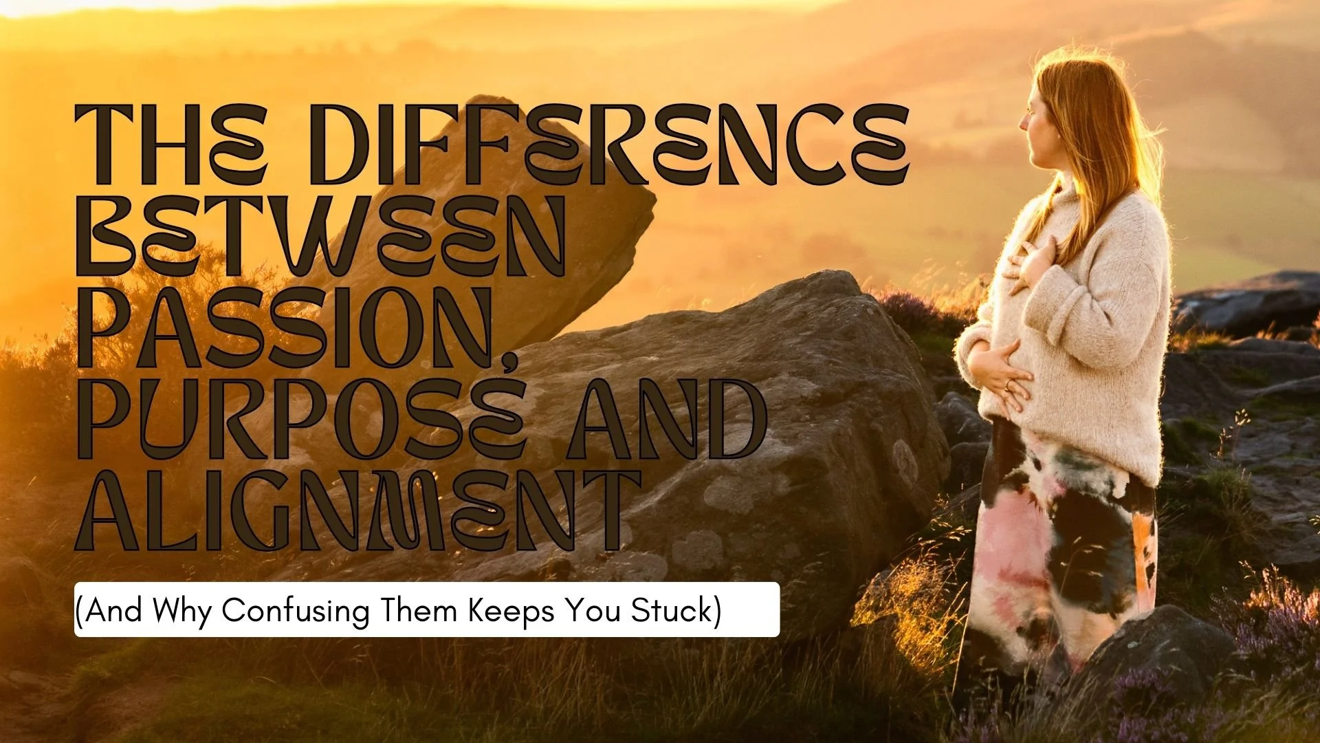 difference between passion, purpose and alignment - woman on rocky edge holding belly and looking out to the sunset