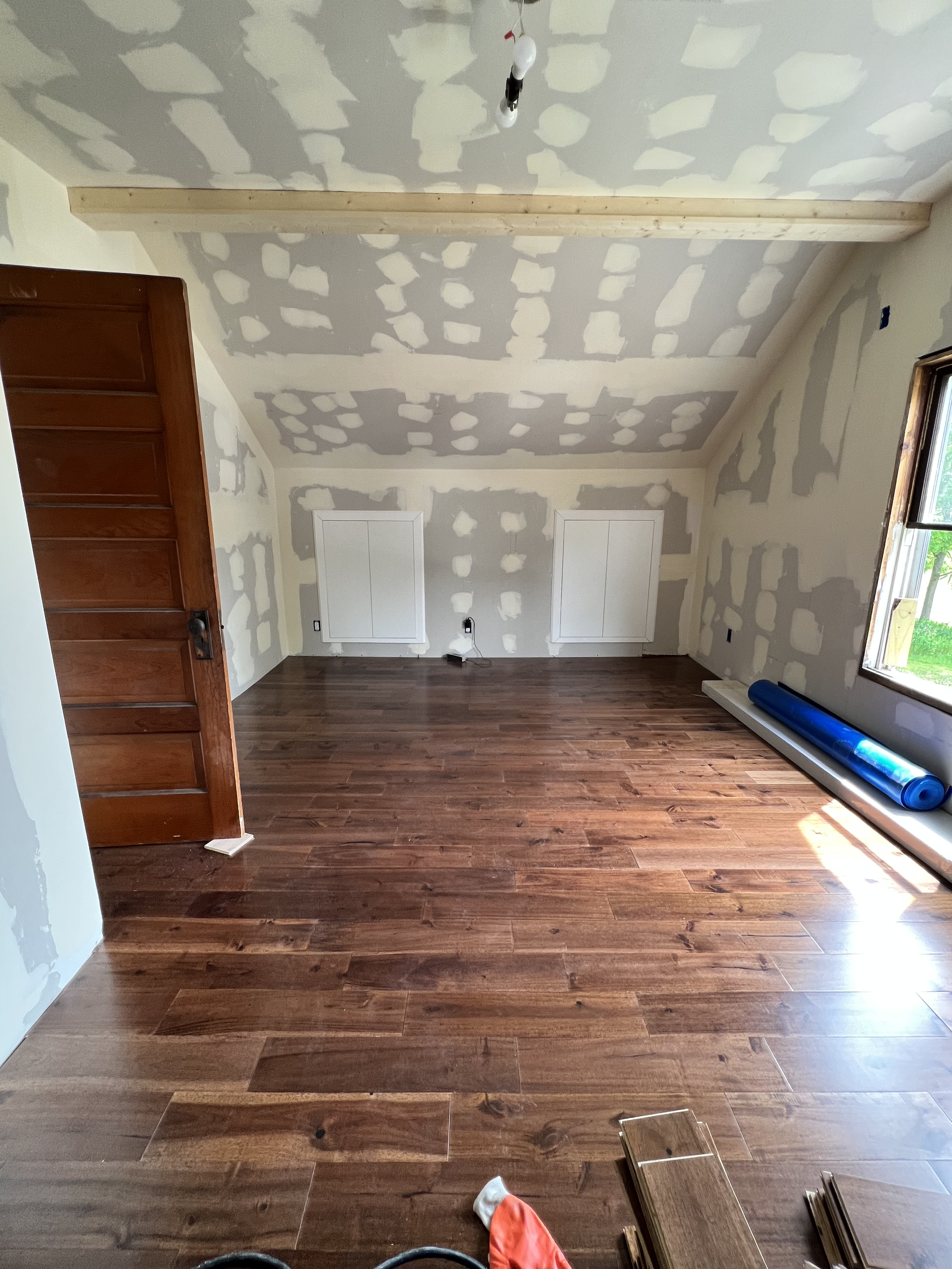 Upstairs Bedrooms- after ( Expanded walls to included storage areas. Ceiling was raised in Cathedral style with exposed wood beams 