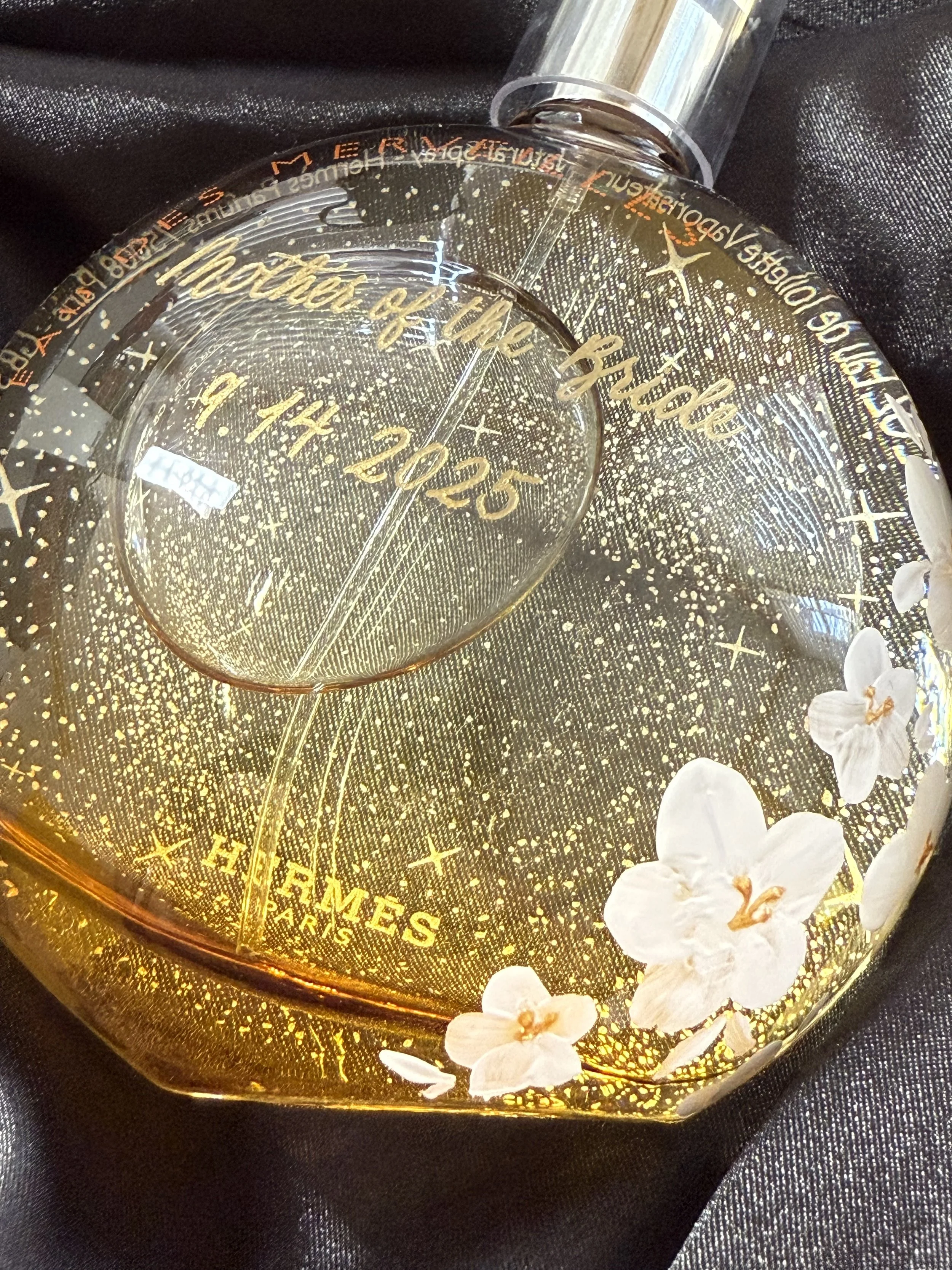 Bottle Painted with white flowers on the right side and engraving across the center in gold calligraphy. Mother of the Bride Gift