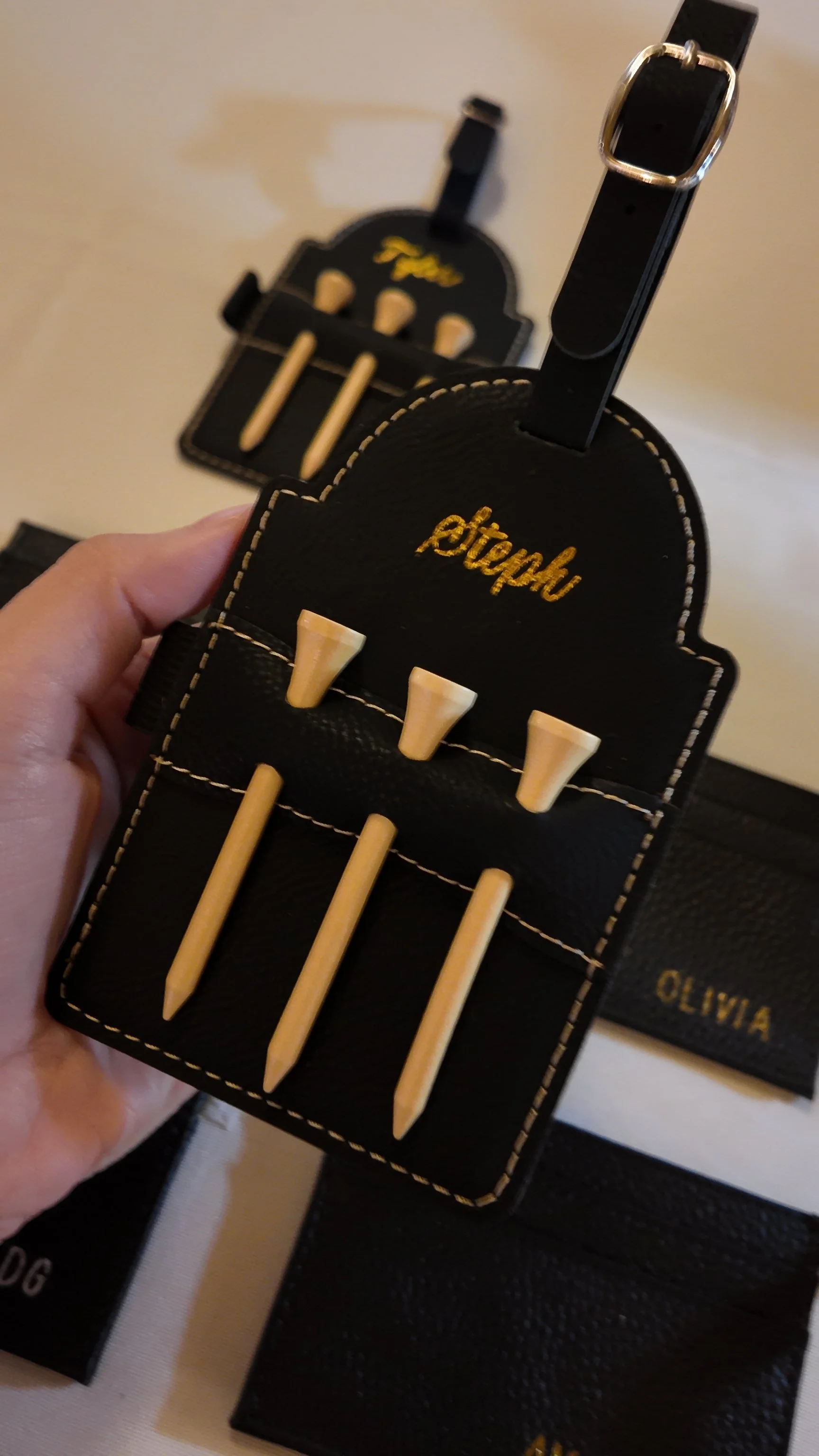 golf tee tag with gold calligraphy personalization