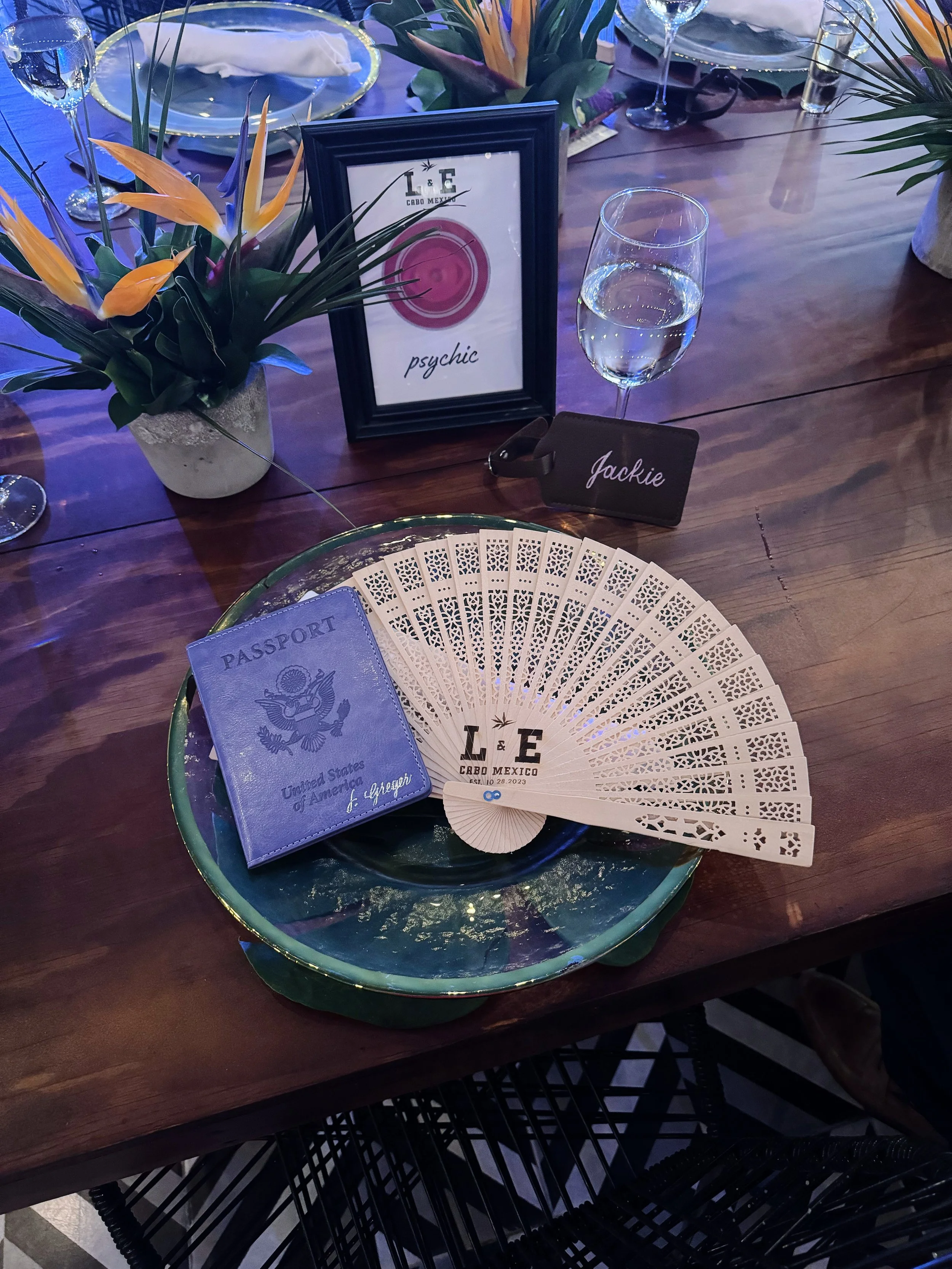 Purple passport cover with white fan on table