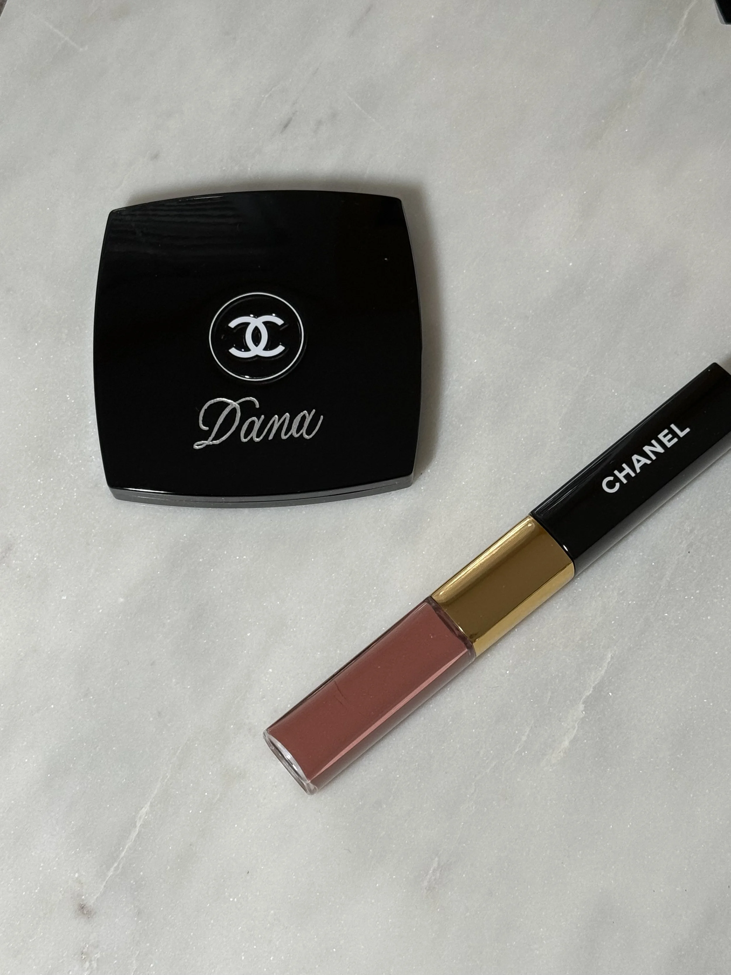 Chanel compact mirror engraved in silver "Dana" and a Chanel pink liquid lipstick