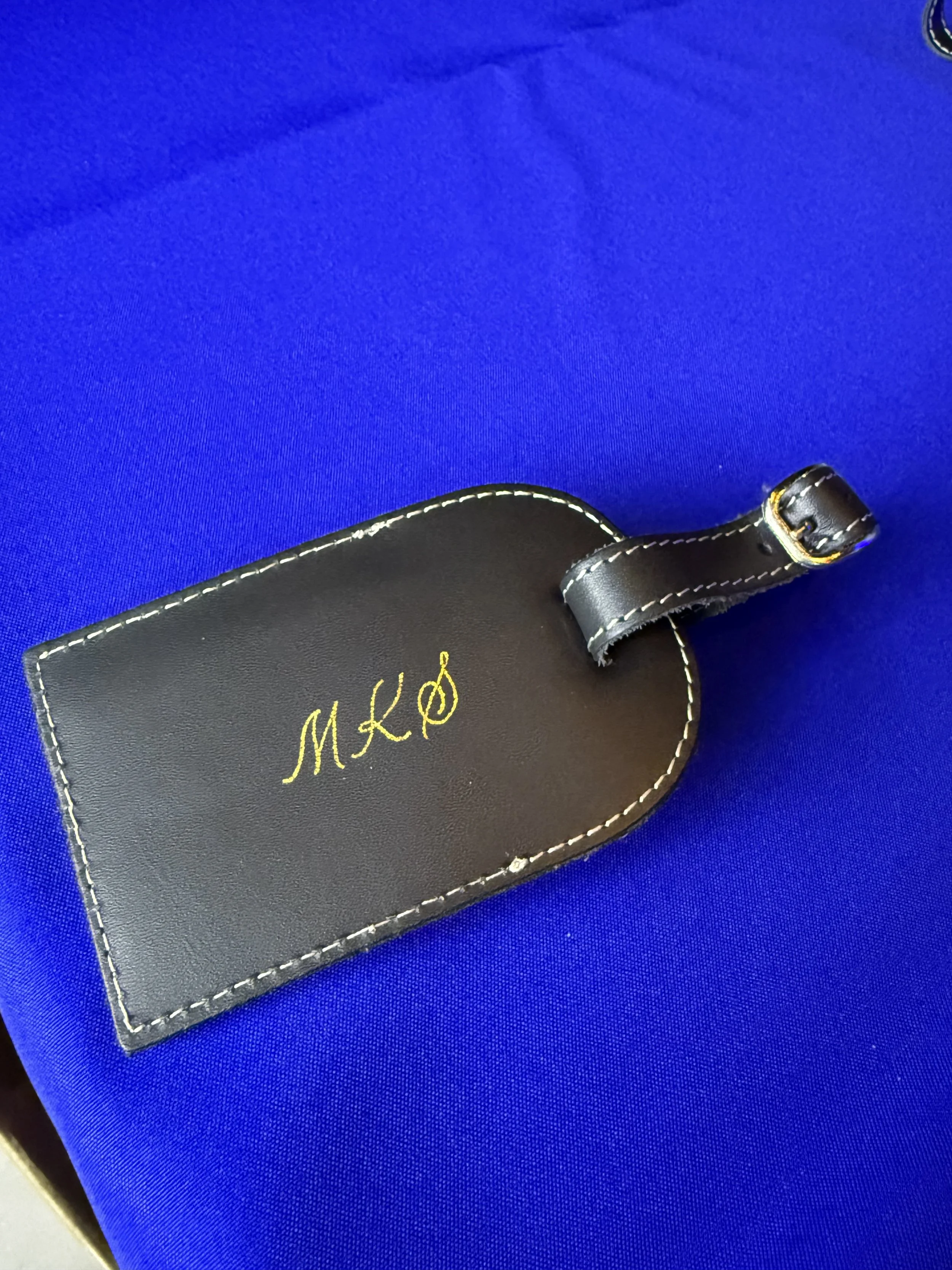 Luggage Tag Heat Foiling with gold calligraphy initials MKS