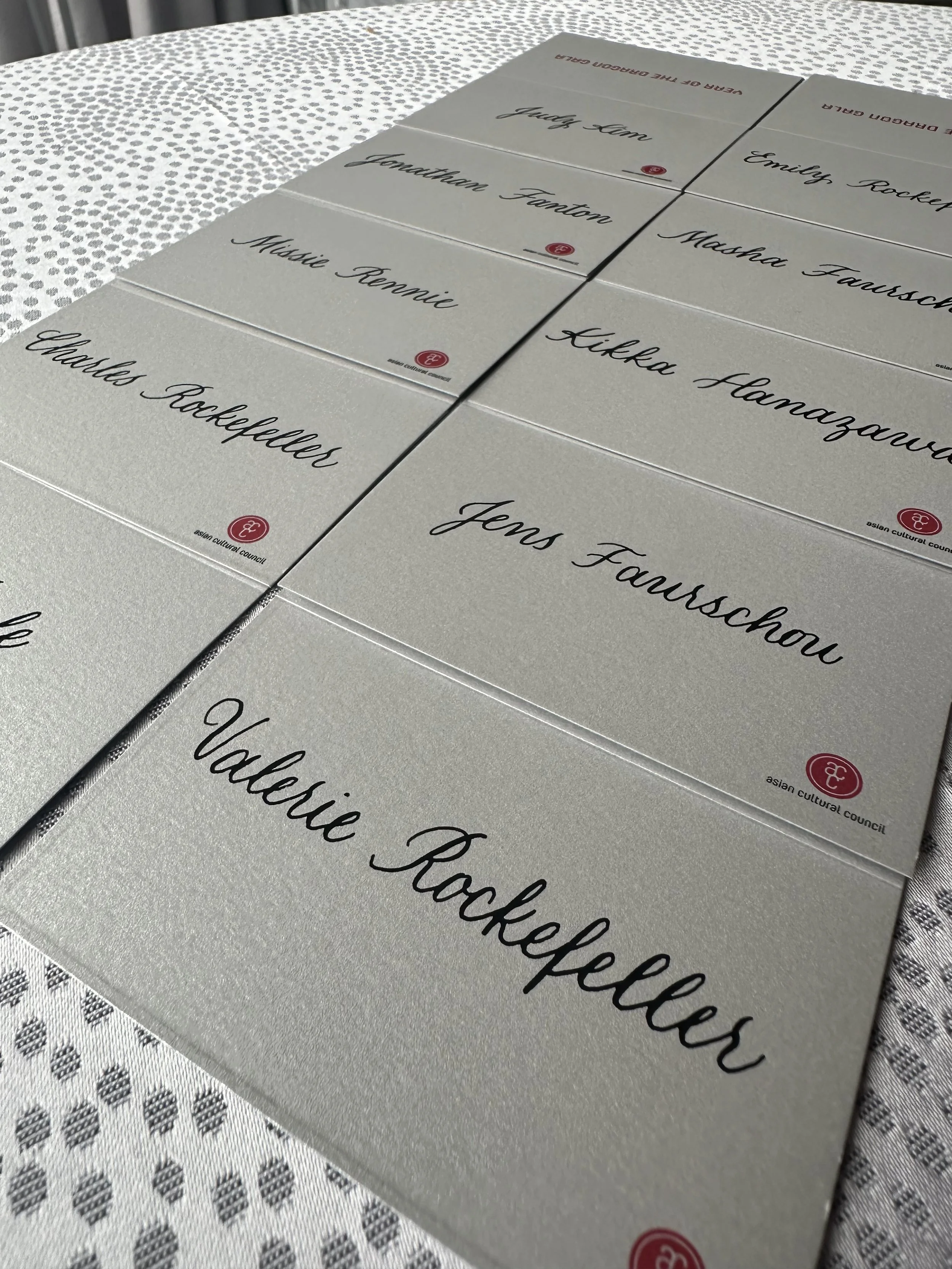 Place Card Calligraphy in black ink on gray cards