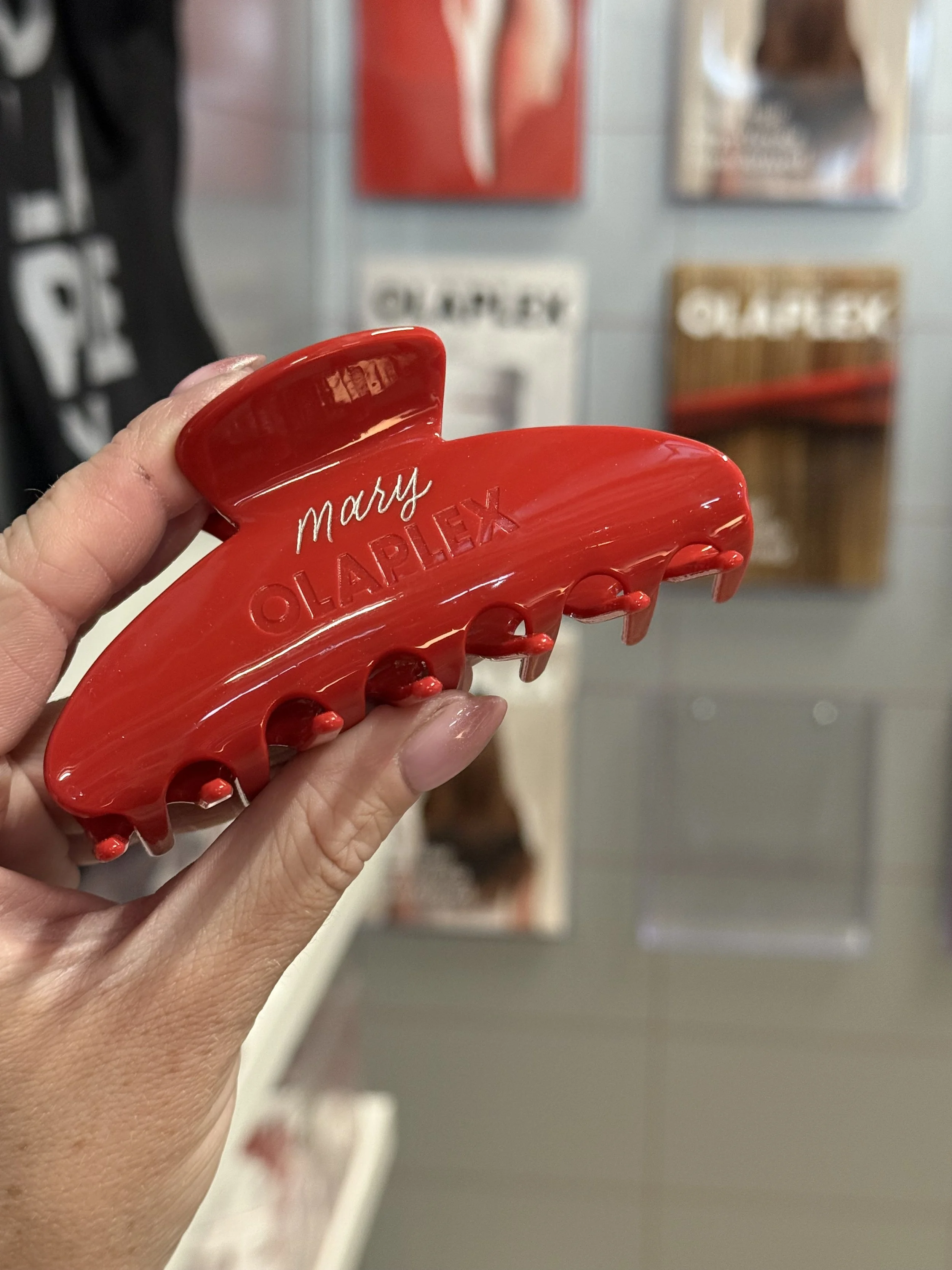 Red Olaplex hair claw clip engraved in silver the name "Mary"