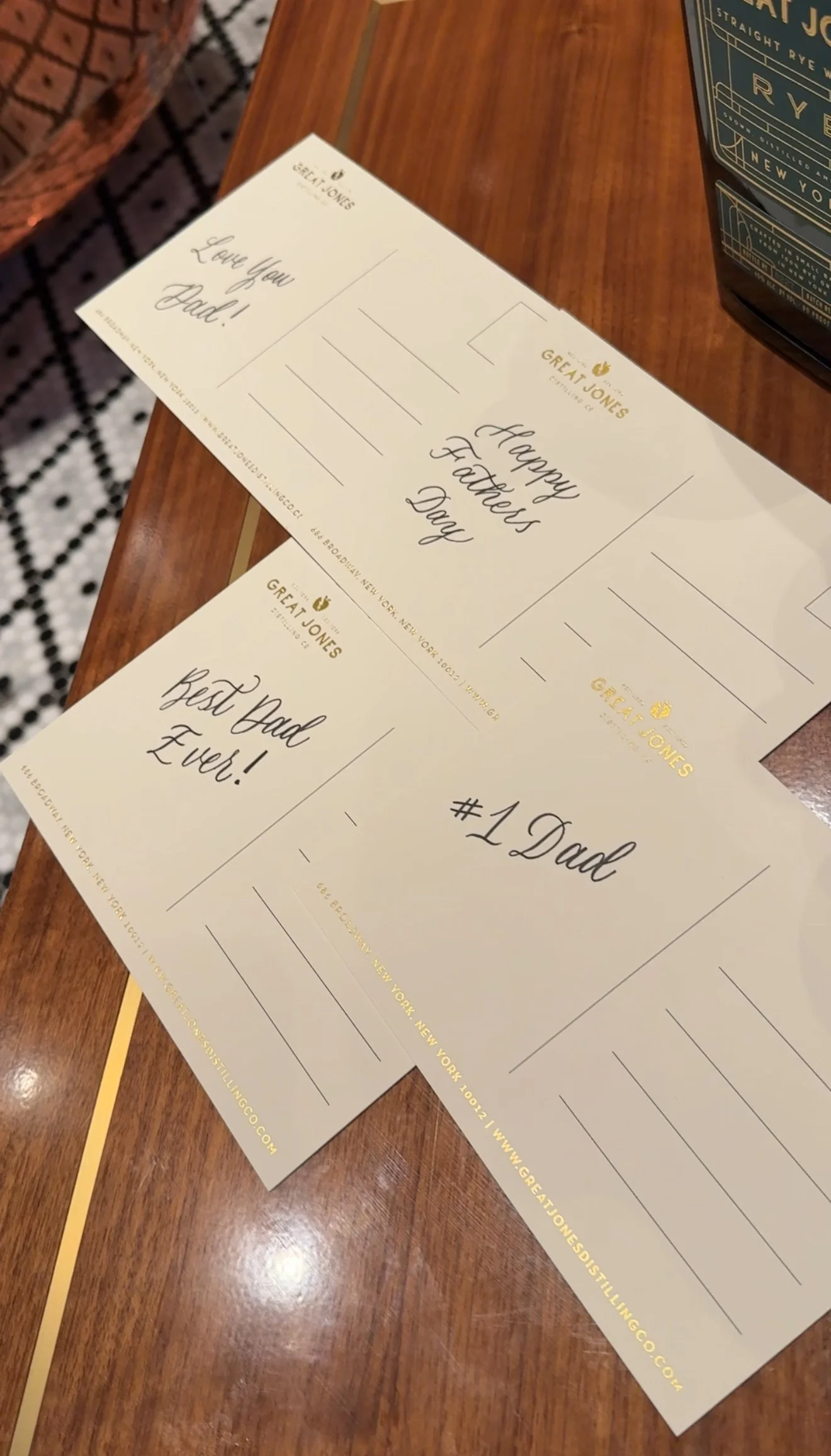 Various post cards with different sayings in black calligraphy for Fathers Day