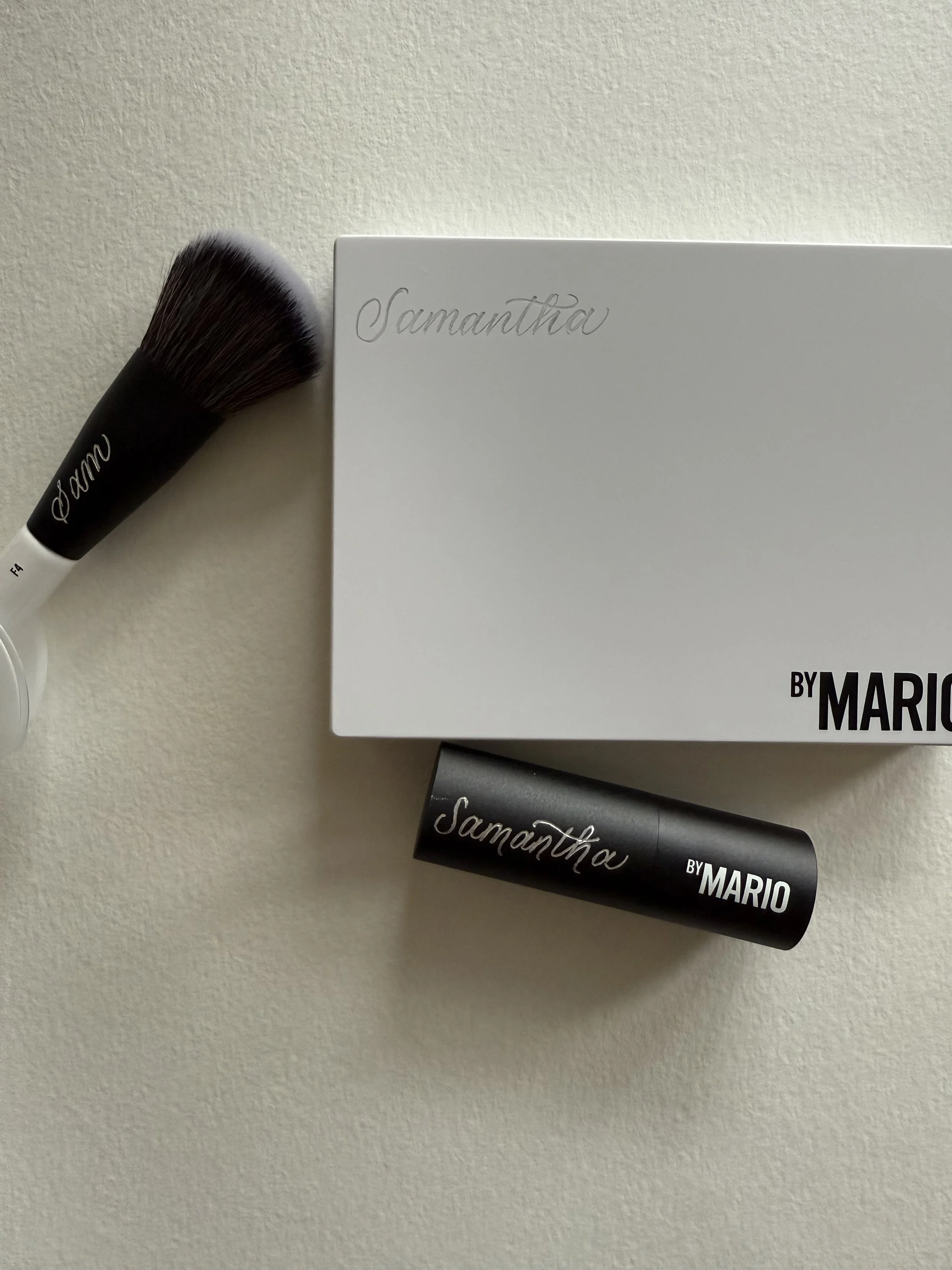 Three Makeup by Mario items engraved in calligraphy
