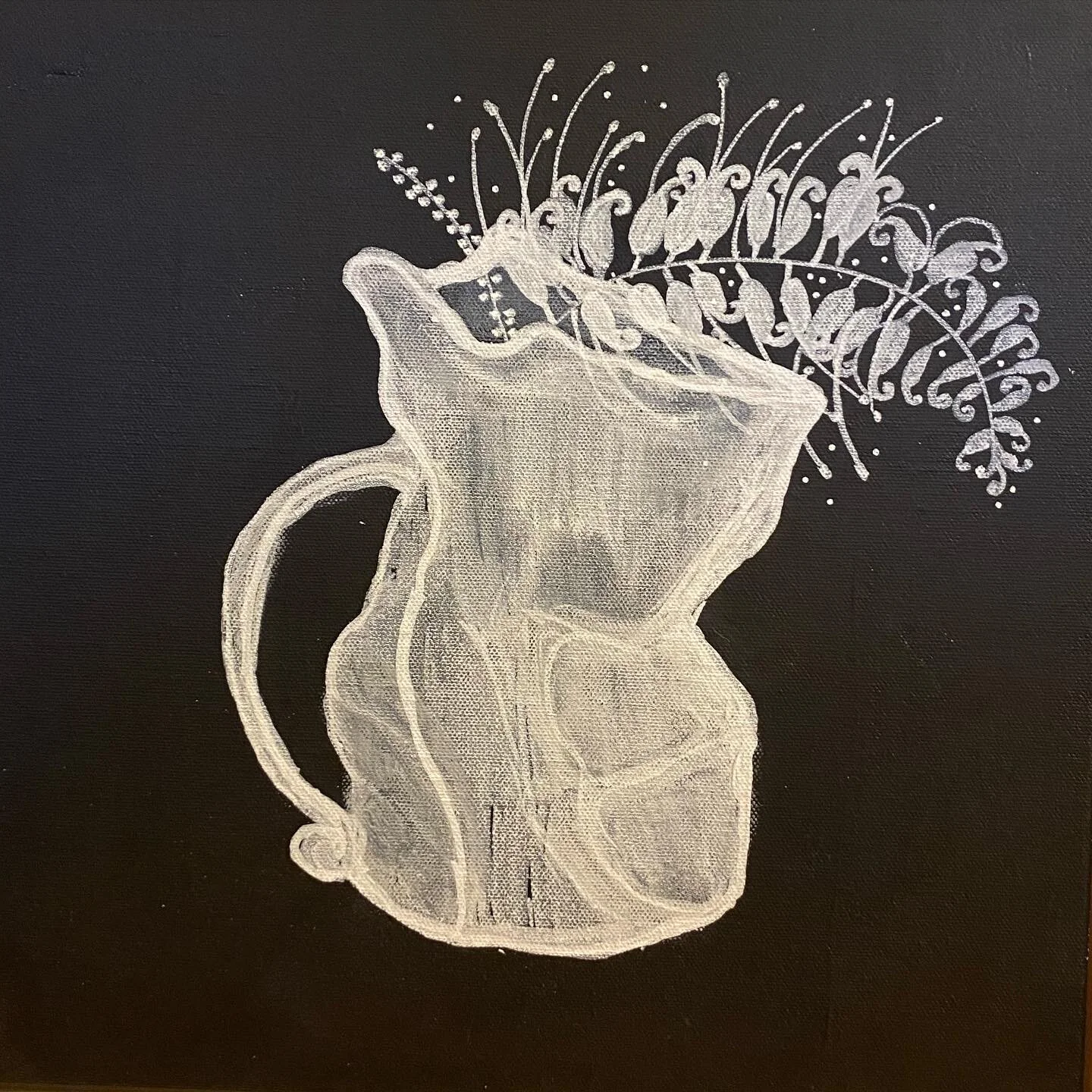 Chalk drawing of a pitcher with decorative fern on black background