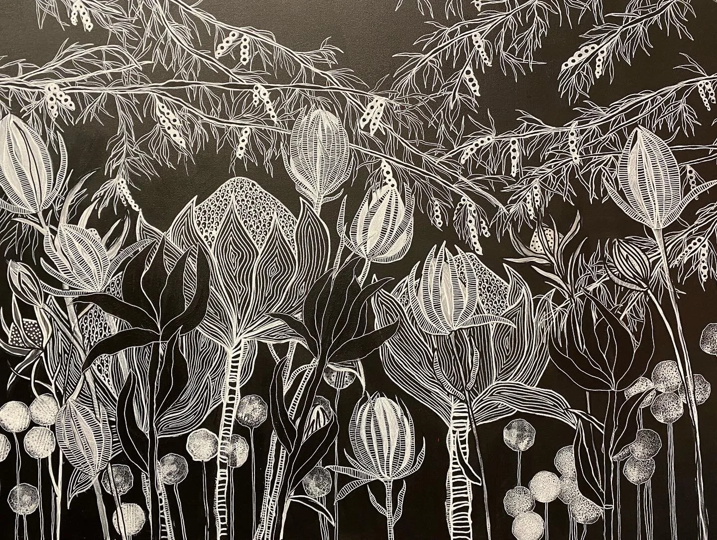 Intricate black and white floral illustration with detailed leaves, flowers, and abstract patterns on a dark background.