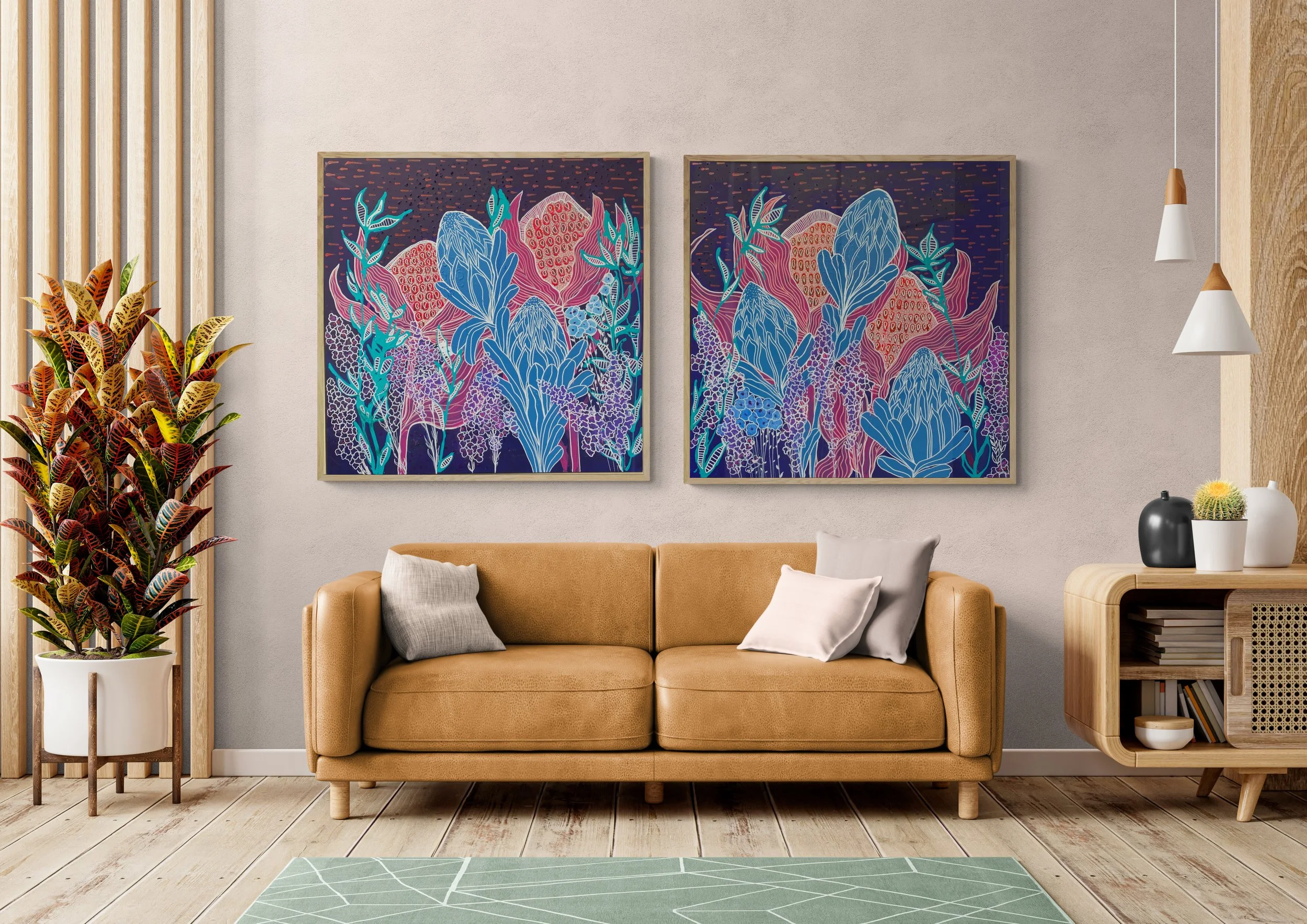 Modern living room with a tan leather sofa, decorative pillows, plant in a white pot, abstract floral paintings on the wall, hanging pendant lights, and wooden side table with vases and decor.