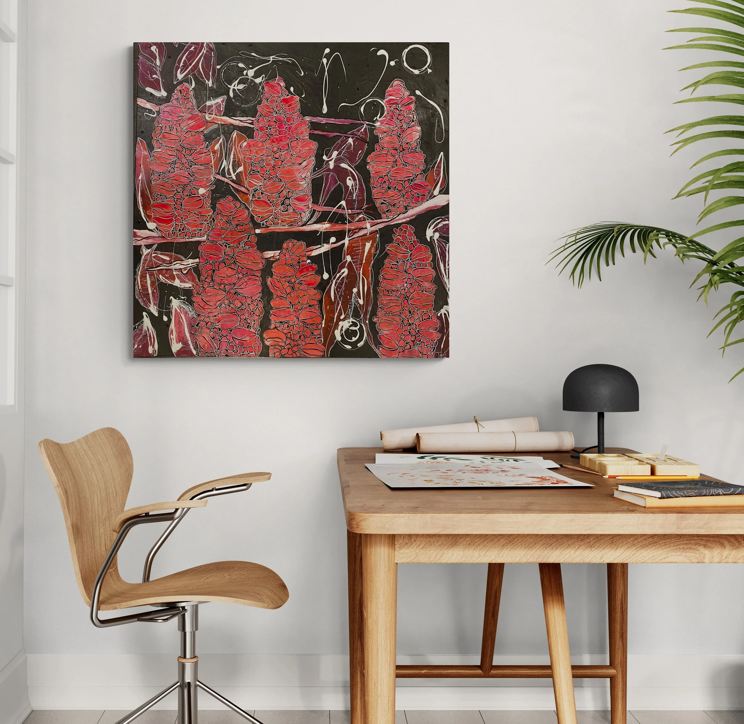 A modern workspace with a wooden desk, an office chair, a black desk lamp, and a large abstract painting of red, pink, and black colors on the wall.