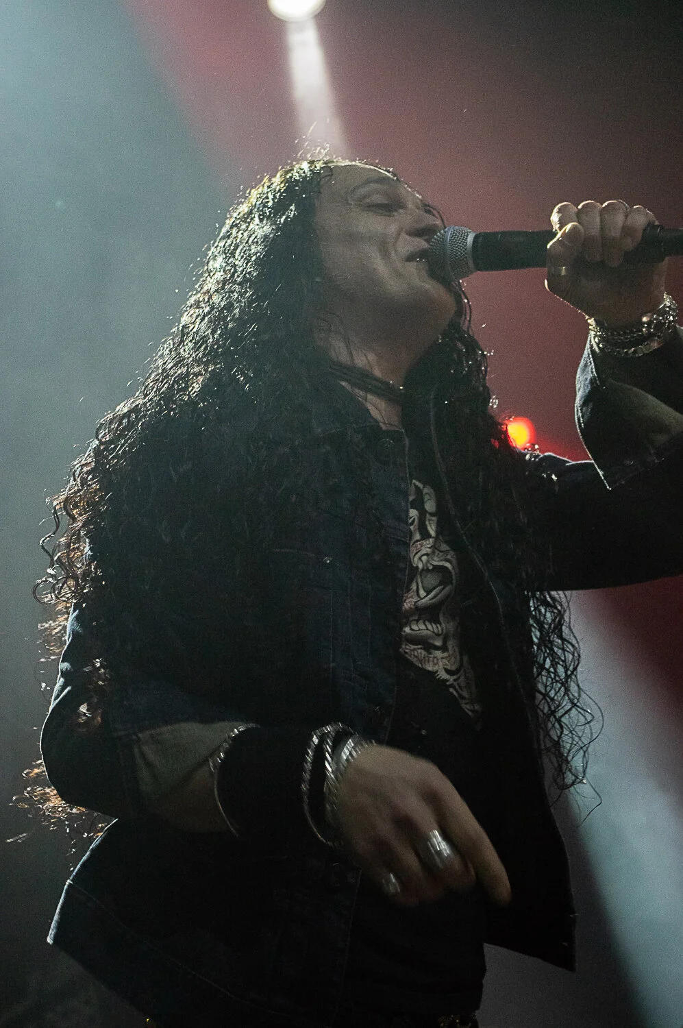 ZP Theart singing under stage lights, Skid Row live in concert at The O2 Forum Kentish Town, January 2019
