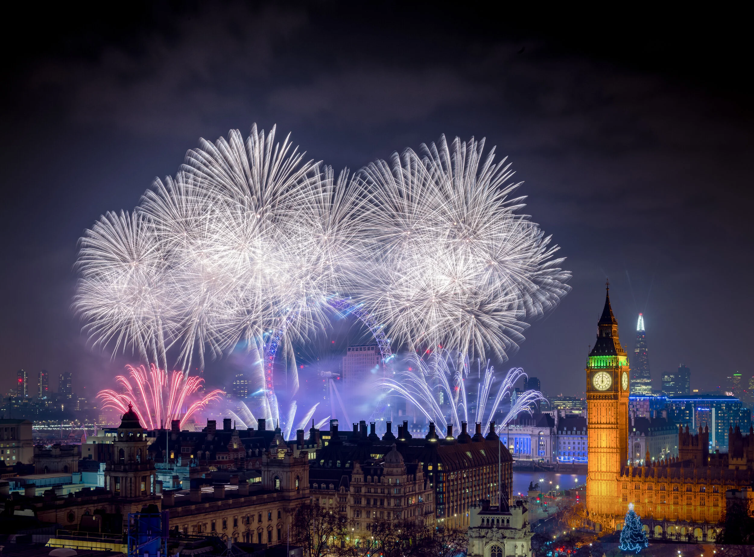 White fireworks over the London Eye beside Elizabeth Tower (Big Ben) on New Year’s Eve, from the rooftop dome of Methodist Central Hall, Westminster. Hasselblad H6D-100c