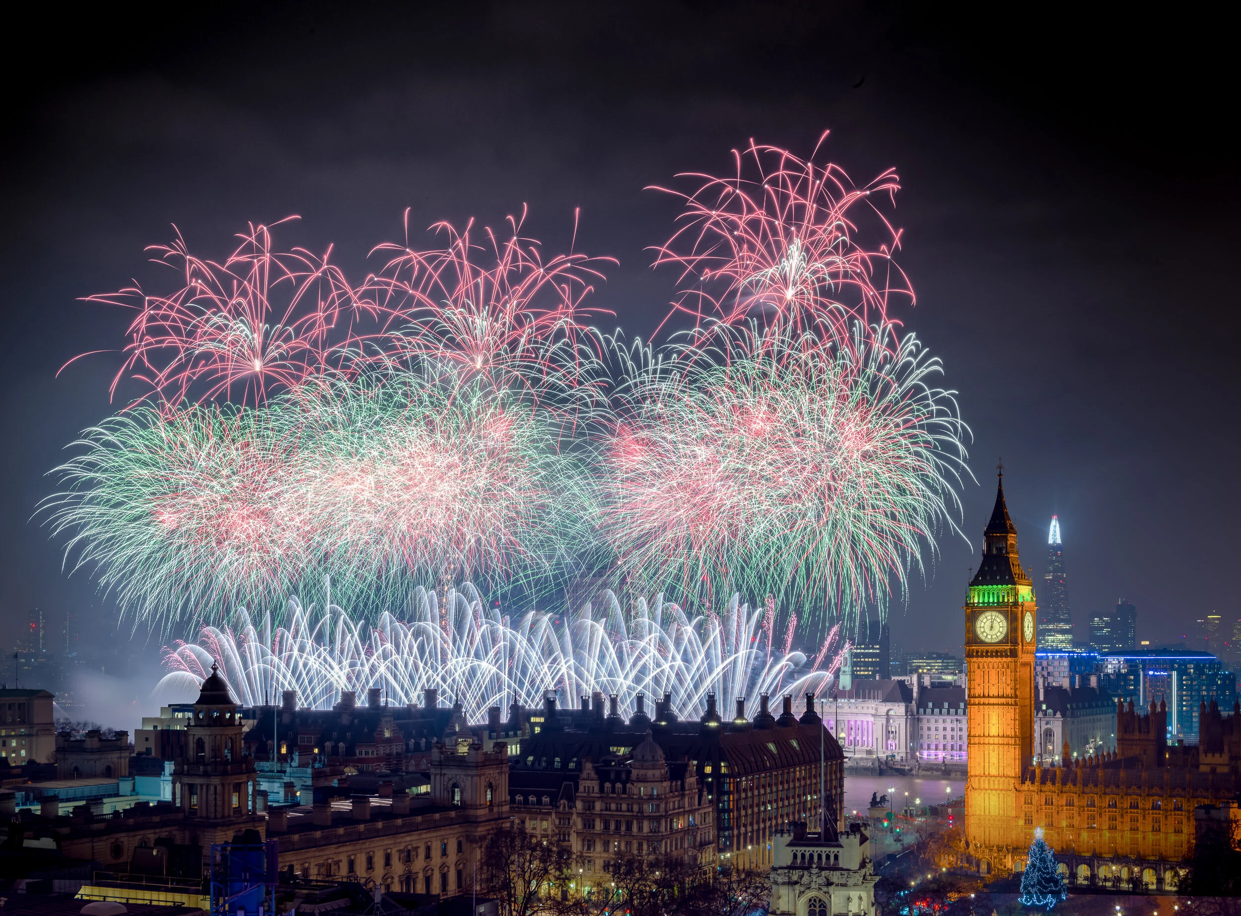 New Year's Eve fireworks over the London Eye beside Elizabeth Tower (Big Ben), seen from the roof of Methodist Central Hall. Taken with a Hasselblad camera.