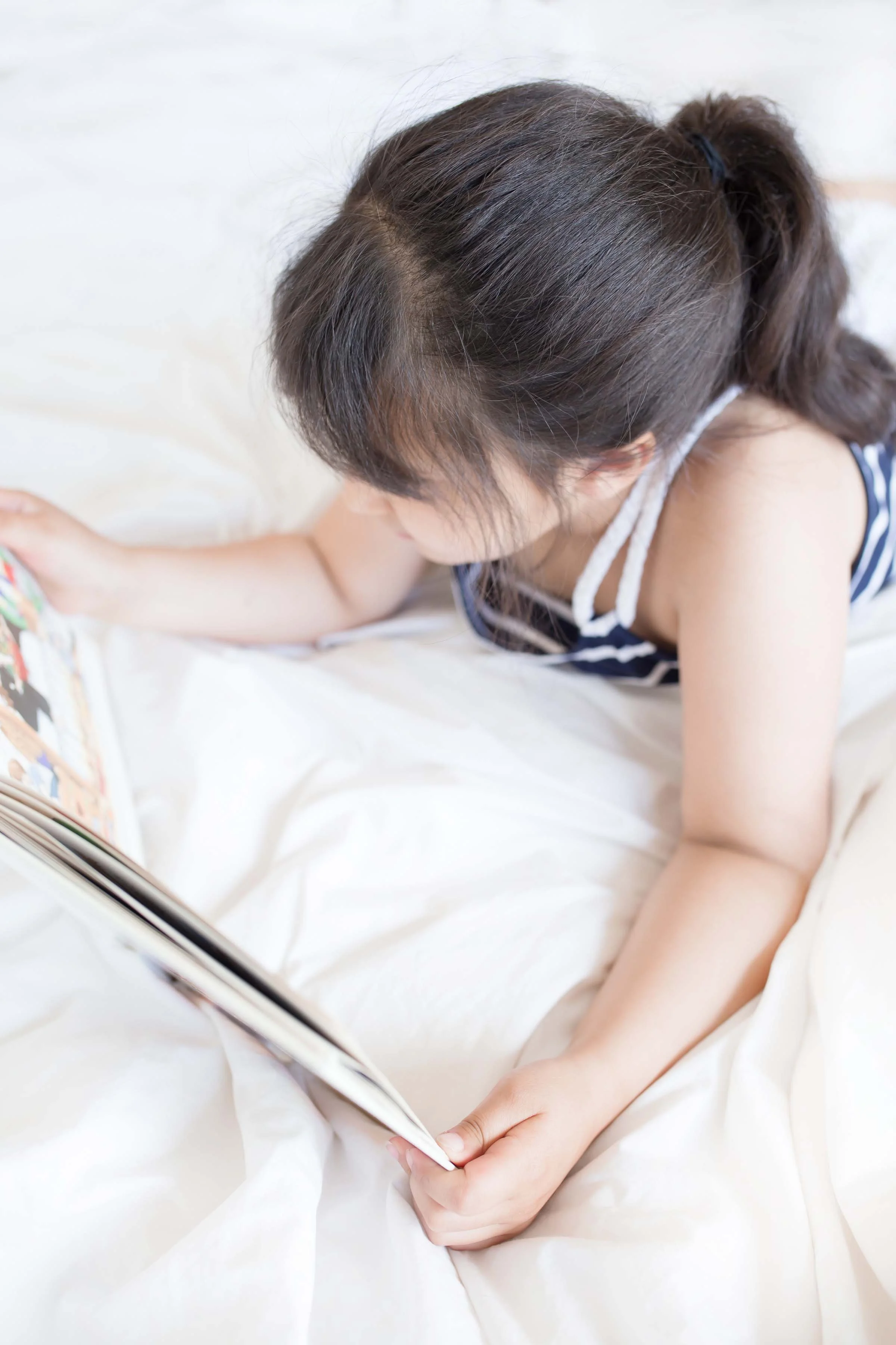 Young girl reading a book