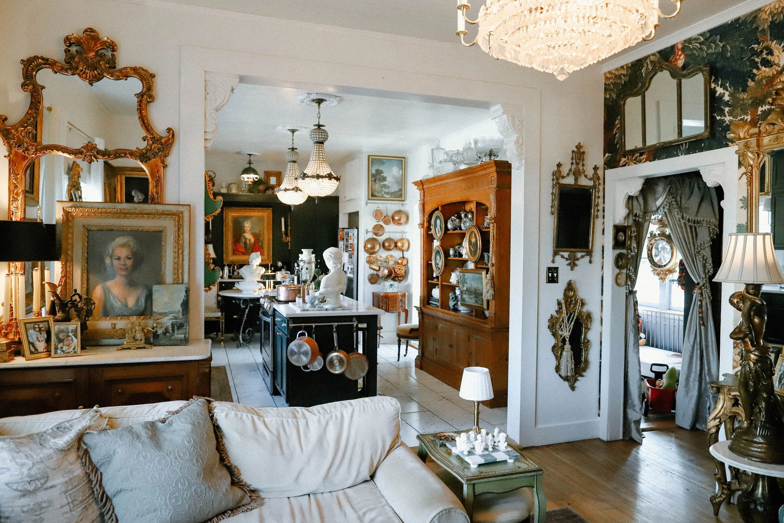 spacious living room and kitchen with modern amenities and historic details