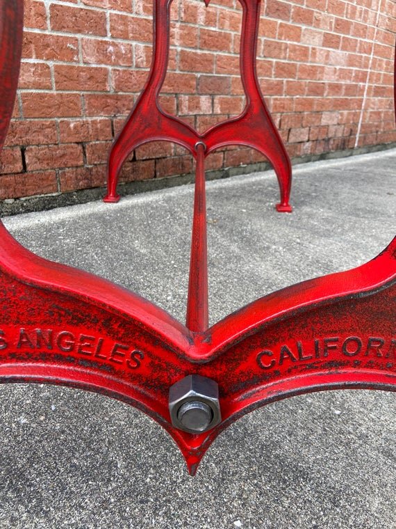 28" Cast Iron Dining Table Base in Rustic Red with Los Angeles Embossment close up bolt image