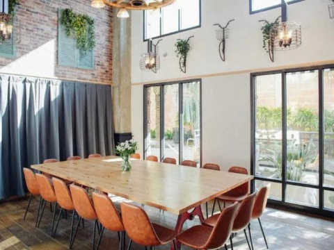 Lon table with cast iron legs in a modern restaurant private dining room