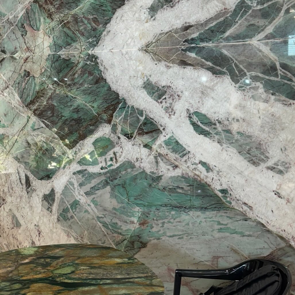 Moldavite Crystal: Stunning, Natural, Captivating. Check out the quartzite in action as a display wall- there are so many uses for natural stone, which one will yours be? Available in Tempe and SLC.

 #quartzite #quartzitecountertops #quartzitekitche