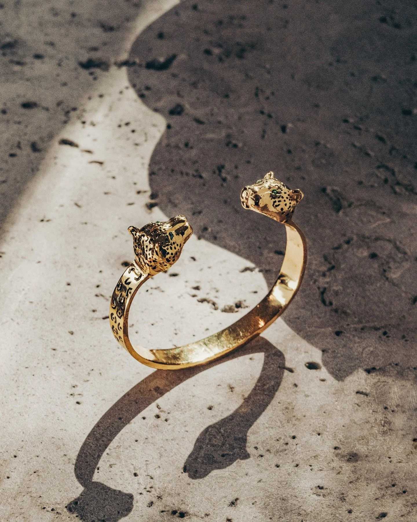 Our Guardian Open Cuff
Handcrafted bracelet made in 24karat gold plated over brass with 4 Colombian raw emeralds  and black enamel
