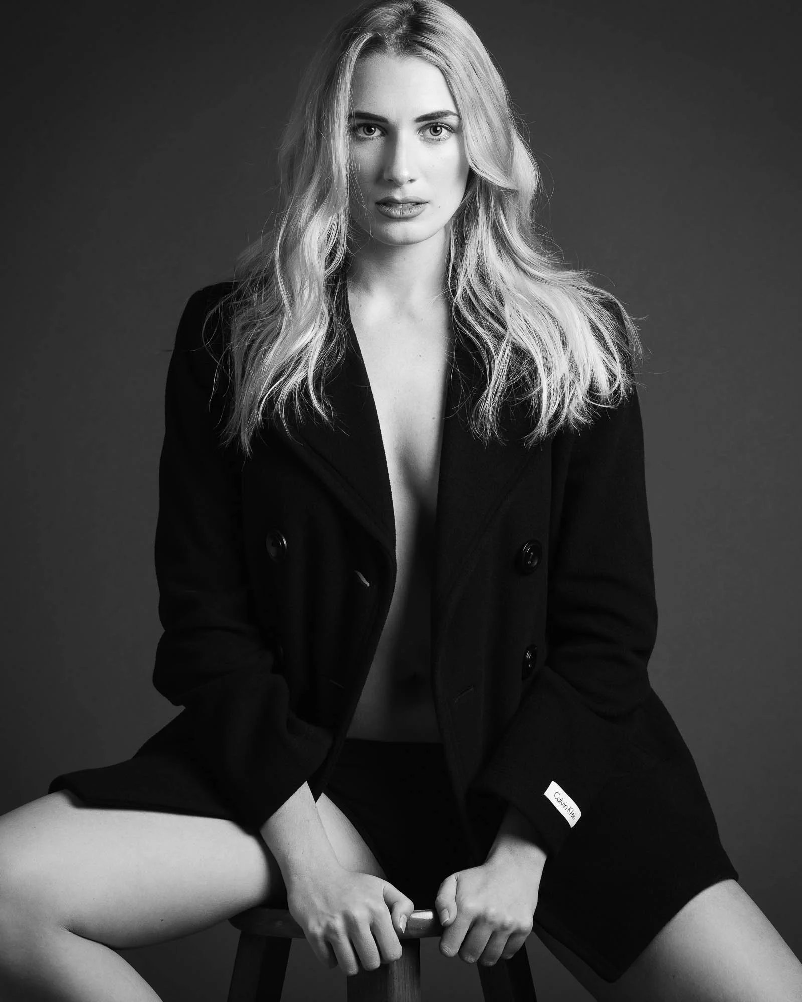 sophisticated boudoir portrait woman implied nude studio