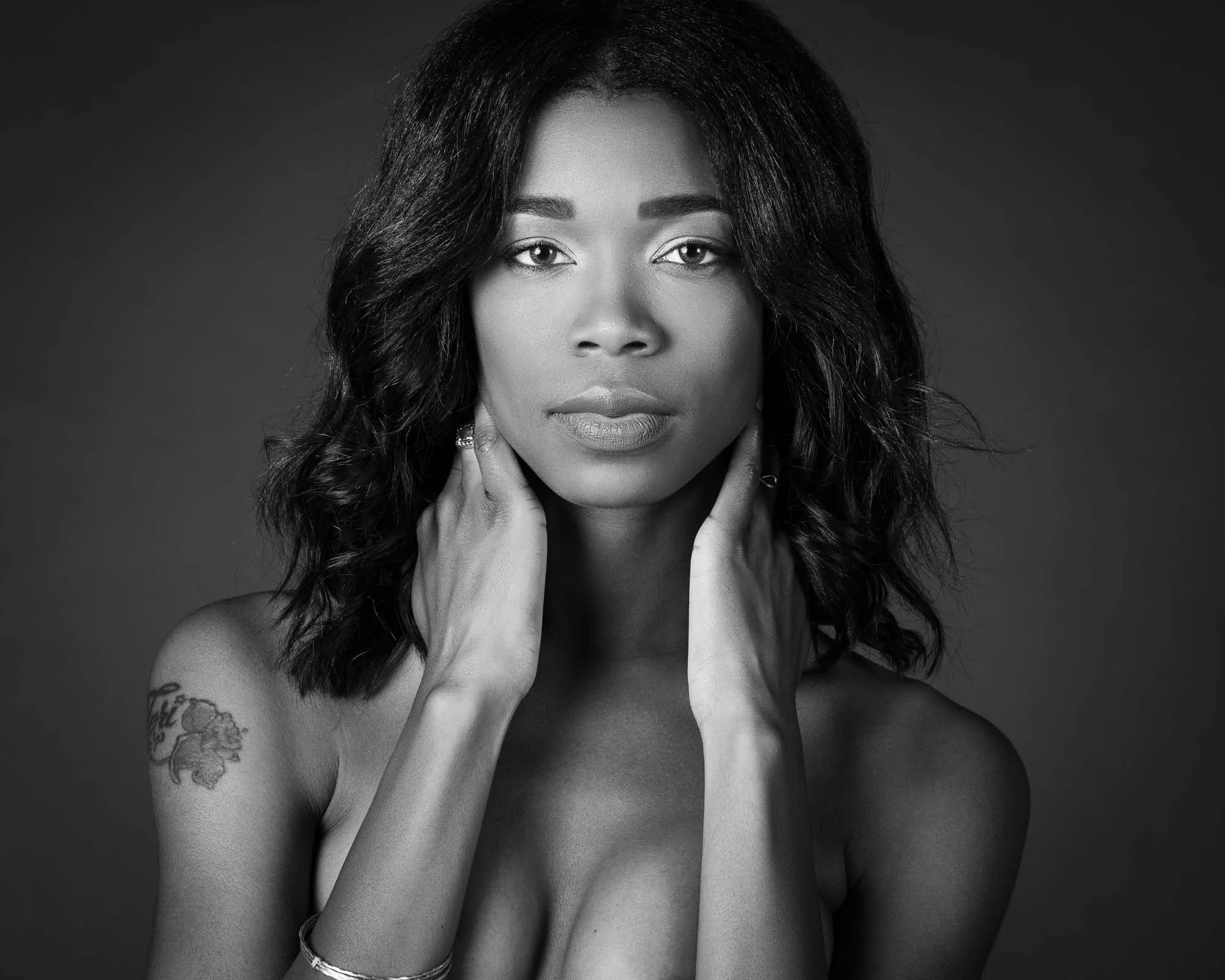 intimate boudoir portrait woman implied nude studio Chicago