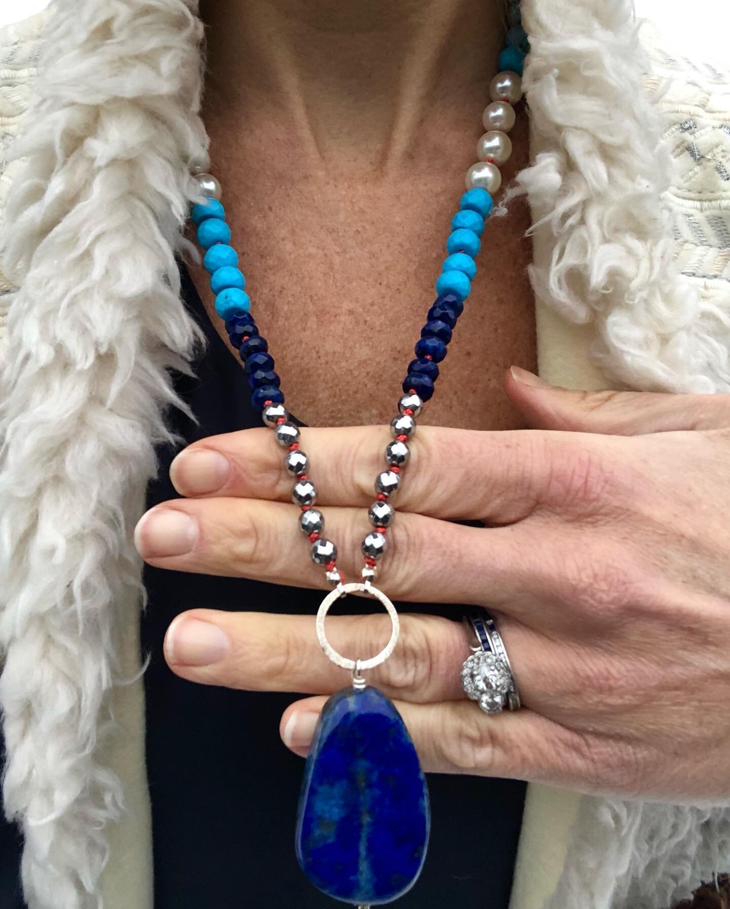 There&rsquo;s no feeling blue when you wear these hues!

This long Lapis beauty is accented with pink silk thread that is individually knotted between each Turquoise, Lapis, and Pearl (synthetic) stones.  Sterling silver accents and components add so