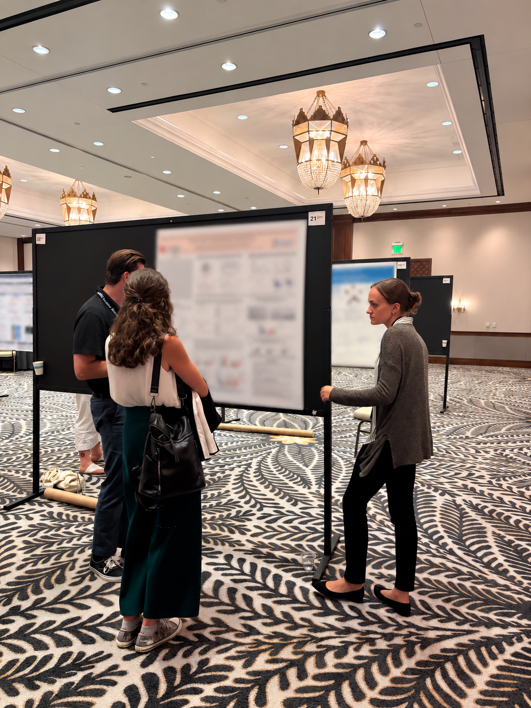 Conference Poster Session in an Elegant Ballroom.png