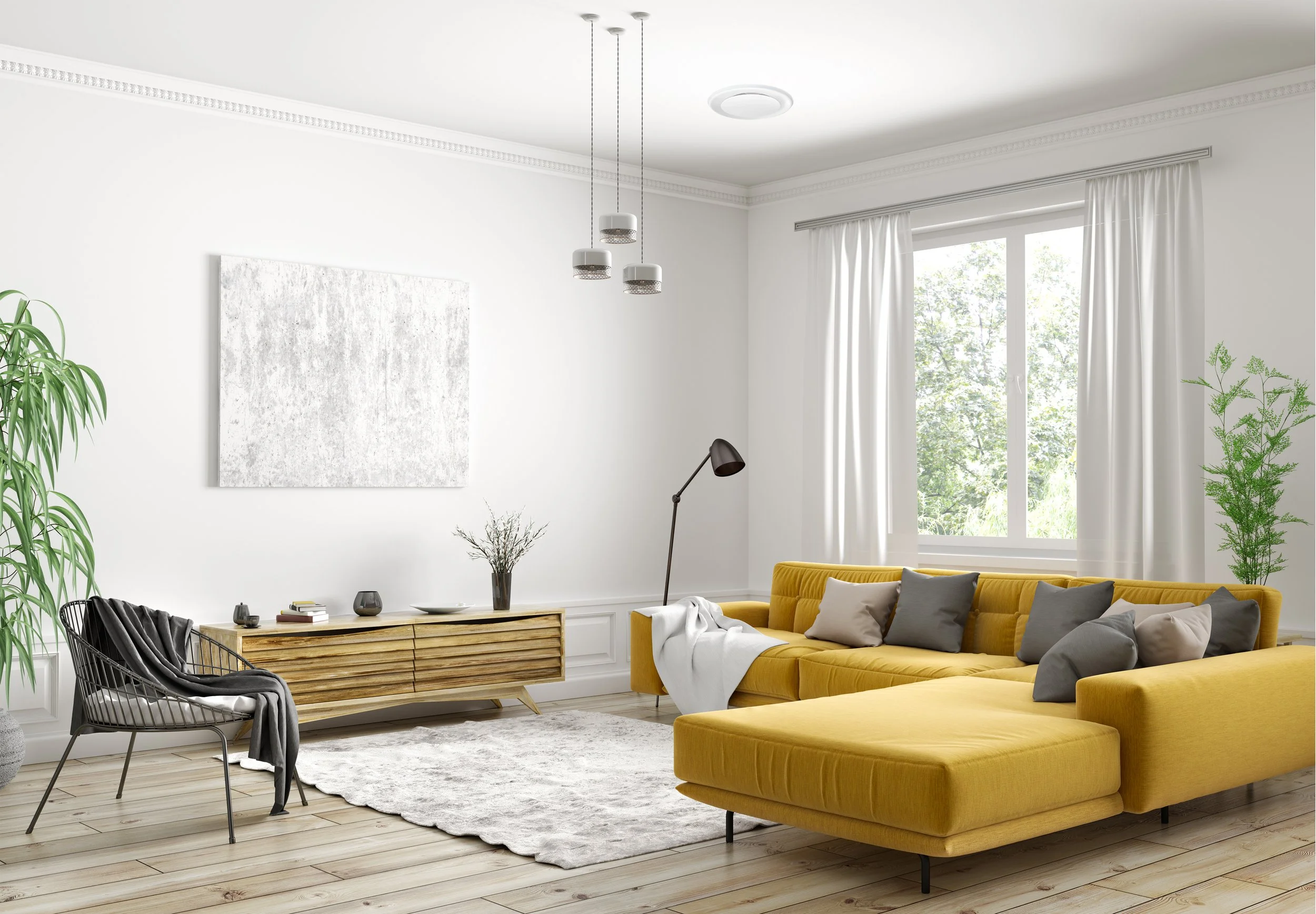 Bright, modern living room with a yellow sectional sofa, gray pillows, a black accent chair with a blanket, wooden console, large window with white curtains, and greenery on the sides.
