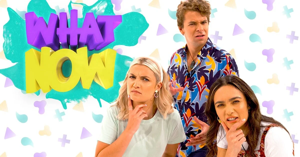 Colorful splash background with three people making questioning expressions beneath the words 'What Now' in bold 3D letters.