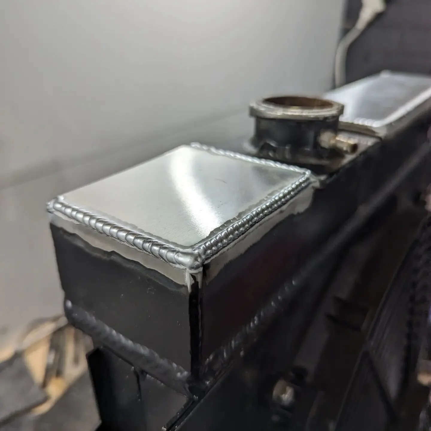 Radiator repair for the afternoon, the fill point was lower than the top of the tank causing an air lock. Trimmed 20mm off the top of the tank and welded shut. 

#welding #tig #tigwelding #aluminium #fabrication #weldporn