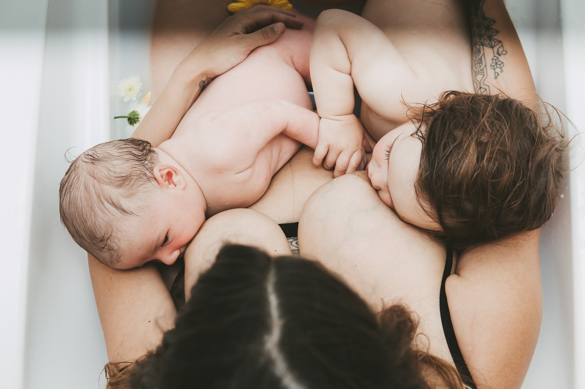 mum breastfeeding a newborn and a toddler.jpg