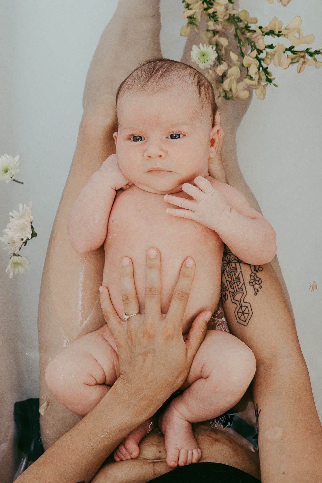 baby in a bath with wild flowers.jpg