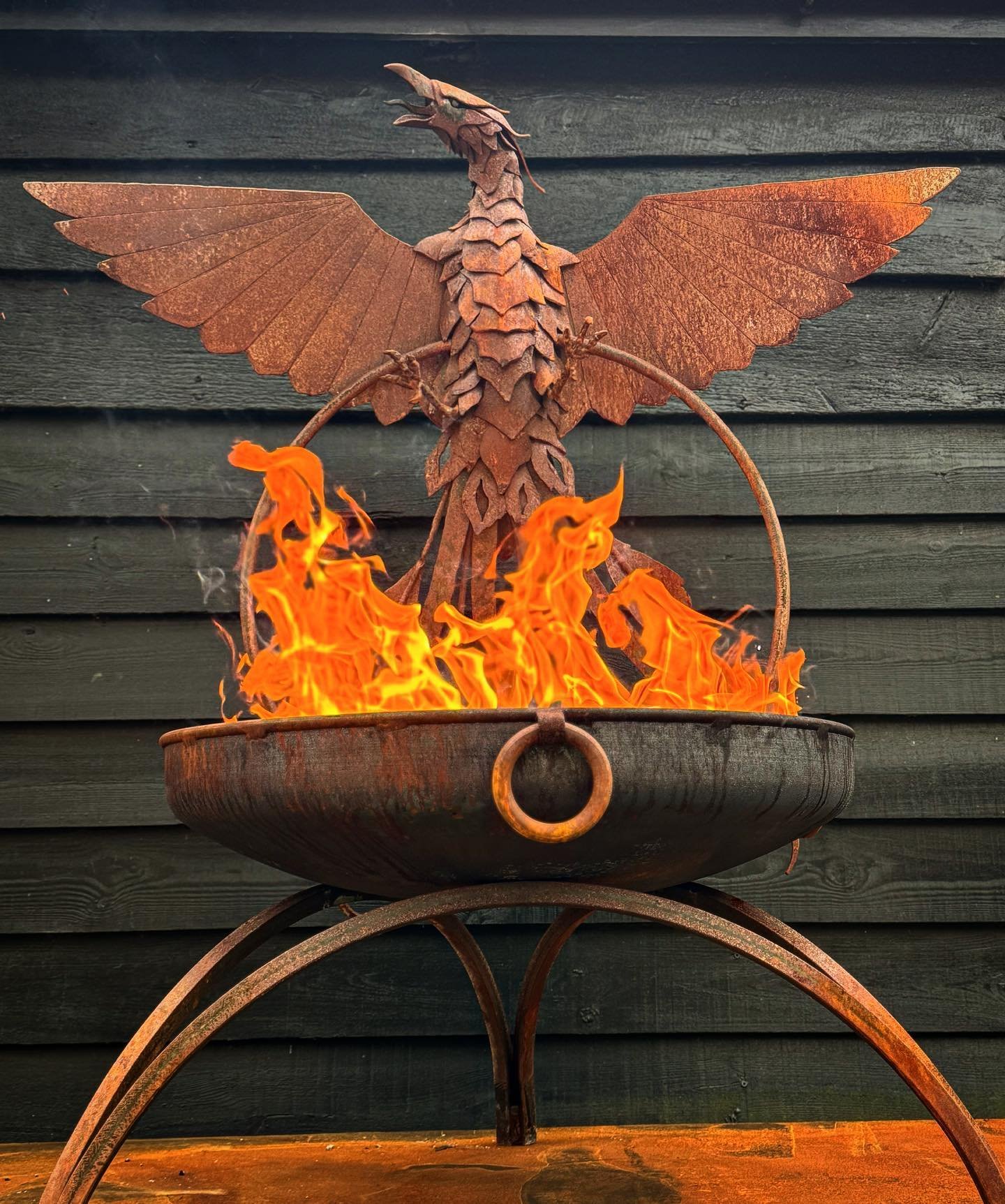 The Phoenix rises! Welded steel sculpture and firebowl. #firebowl #fire #firepit #gardensculpture #blacksmith #artistblacksmith #metalwork #madeinsuffolk #handmade #weldedsculpture #sculpture #phoenix #firebird #gardendesignsideas #metalart #artistic