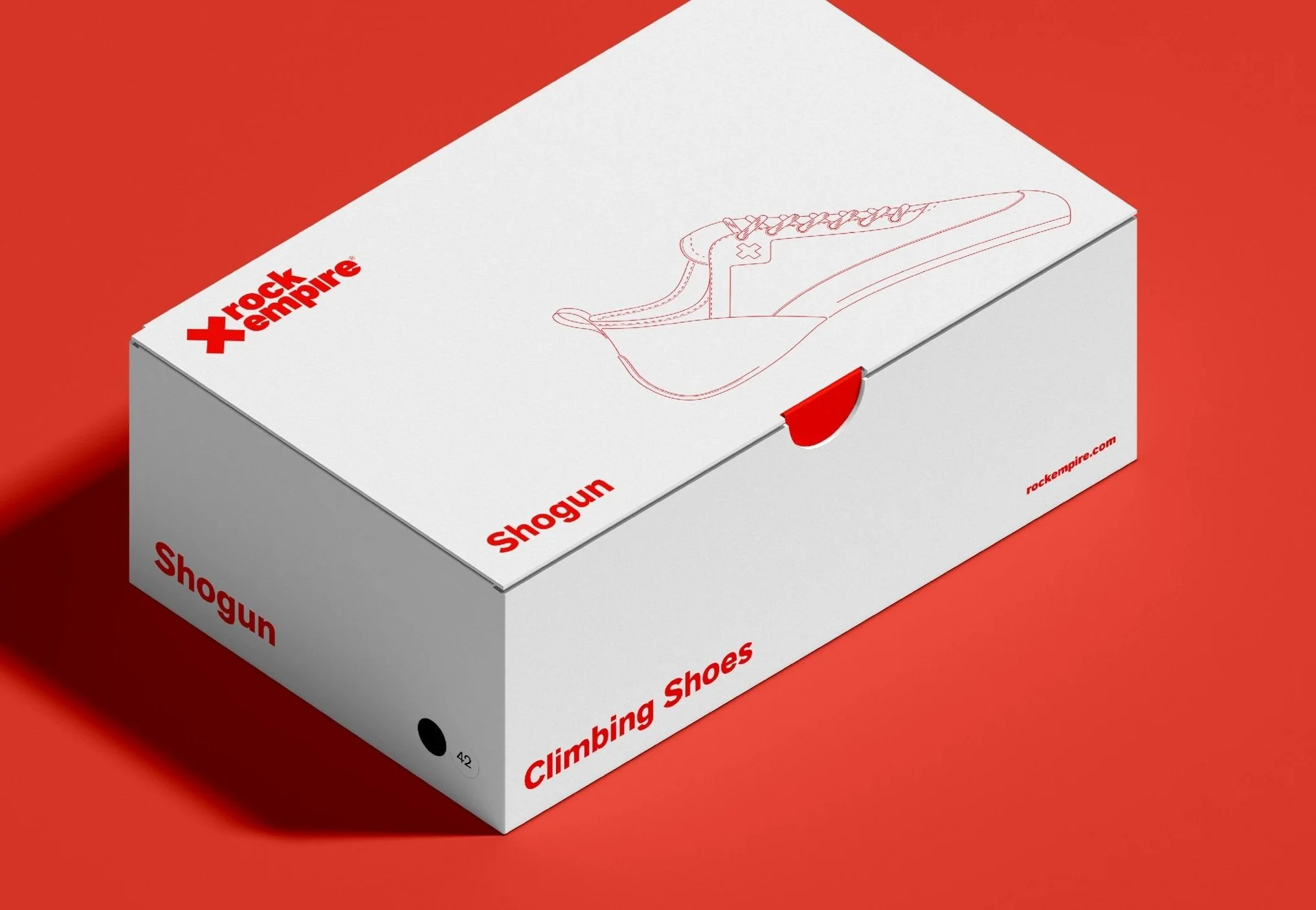 White shoebox with red text and outline of a sneaker, labeled 'rock empire Shogun climbing shoes' on a red background.