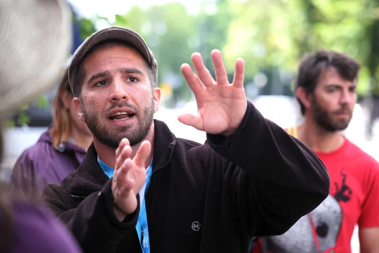 An Original Berlin Walks guide explaining a stop on a walking tour