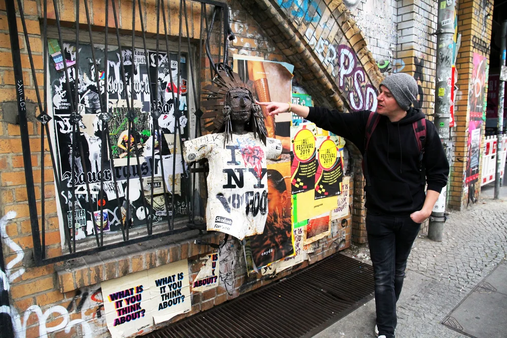 Colourful street art stencil portrait on a Berlin wall