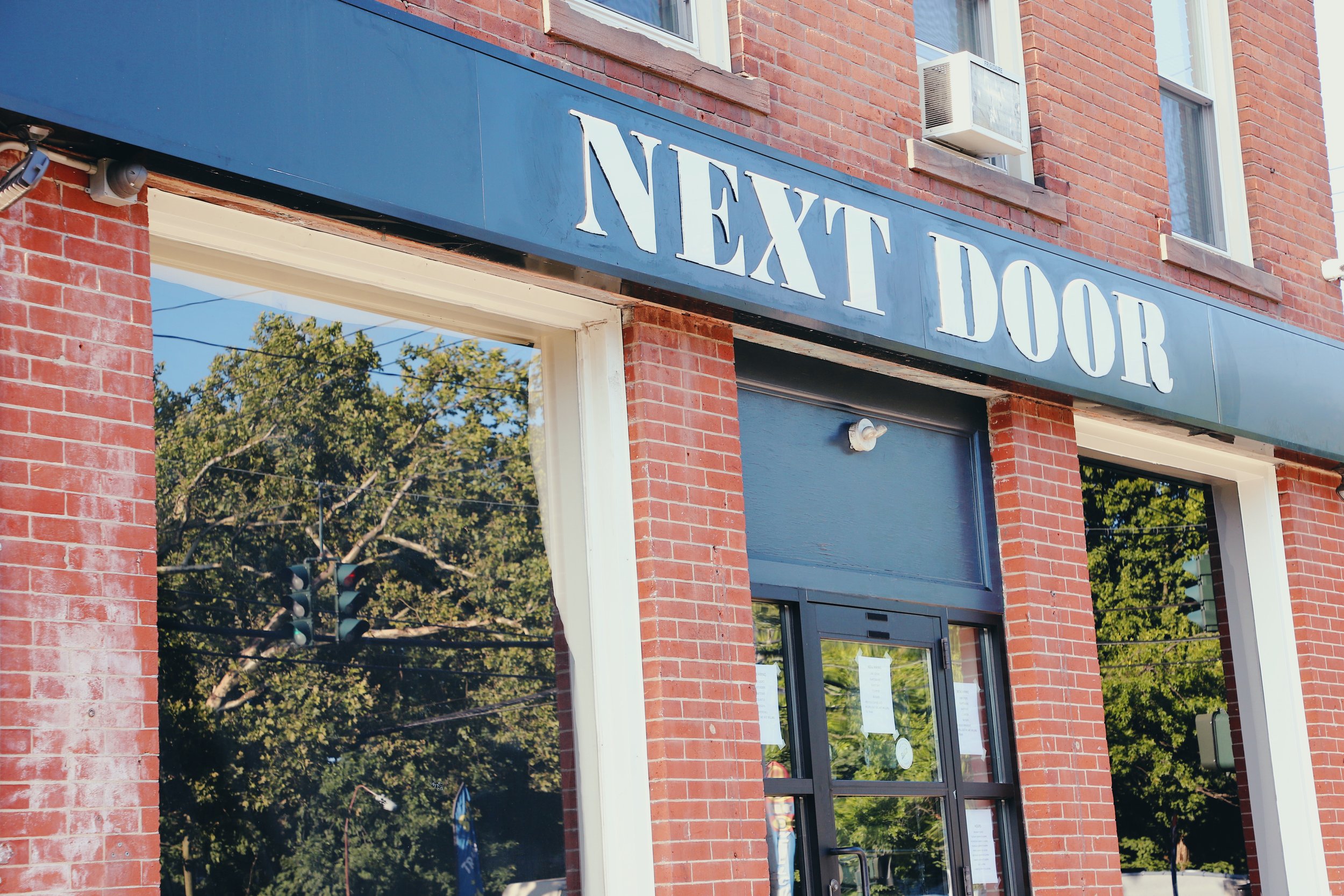 OUR STORY — Next Door