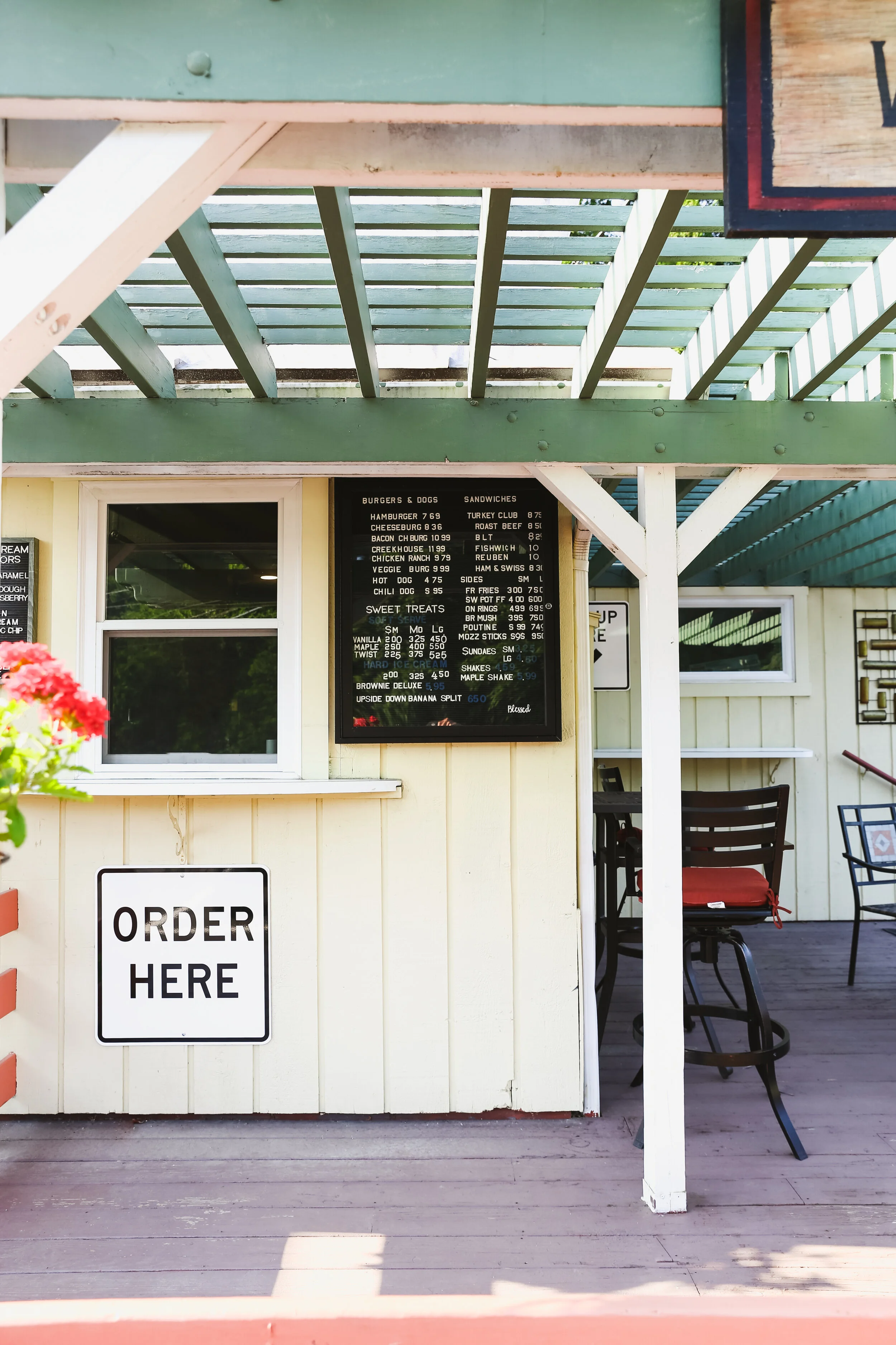 A photo of the exterior of the Creek House Diner displaying their ice cream menu