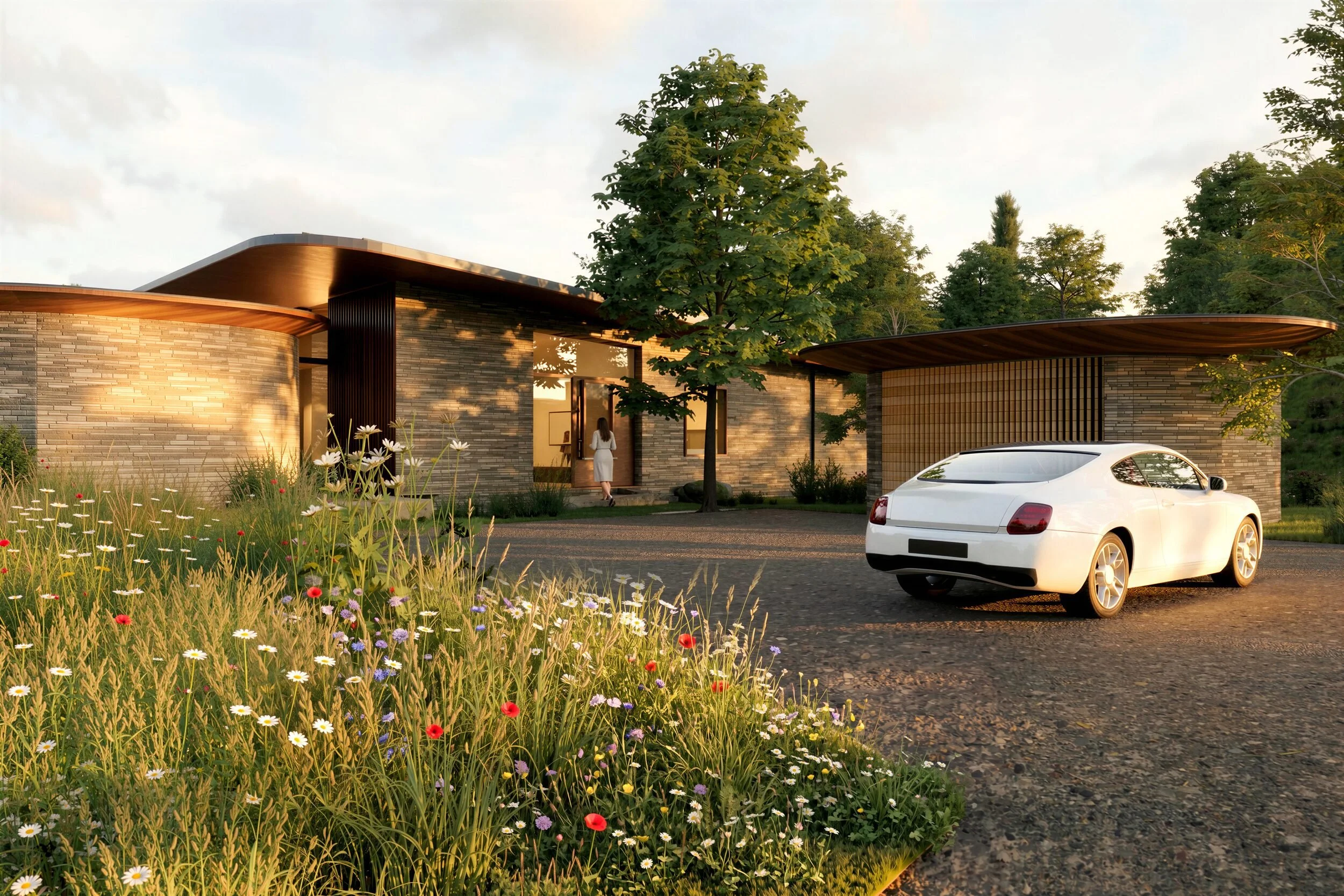 Entrance and gravel drive at Brow House, with the oval garage under its own curved roof beside the stone and timber house