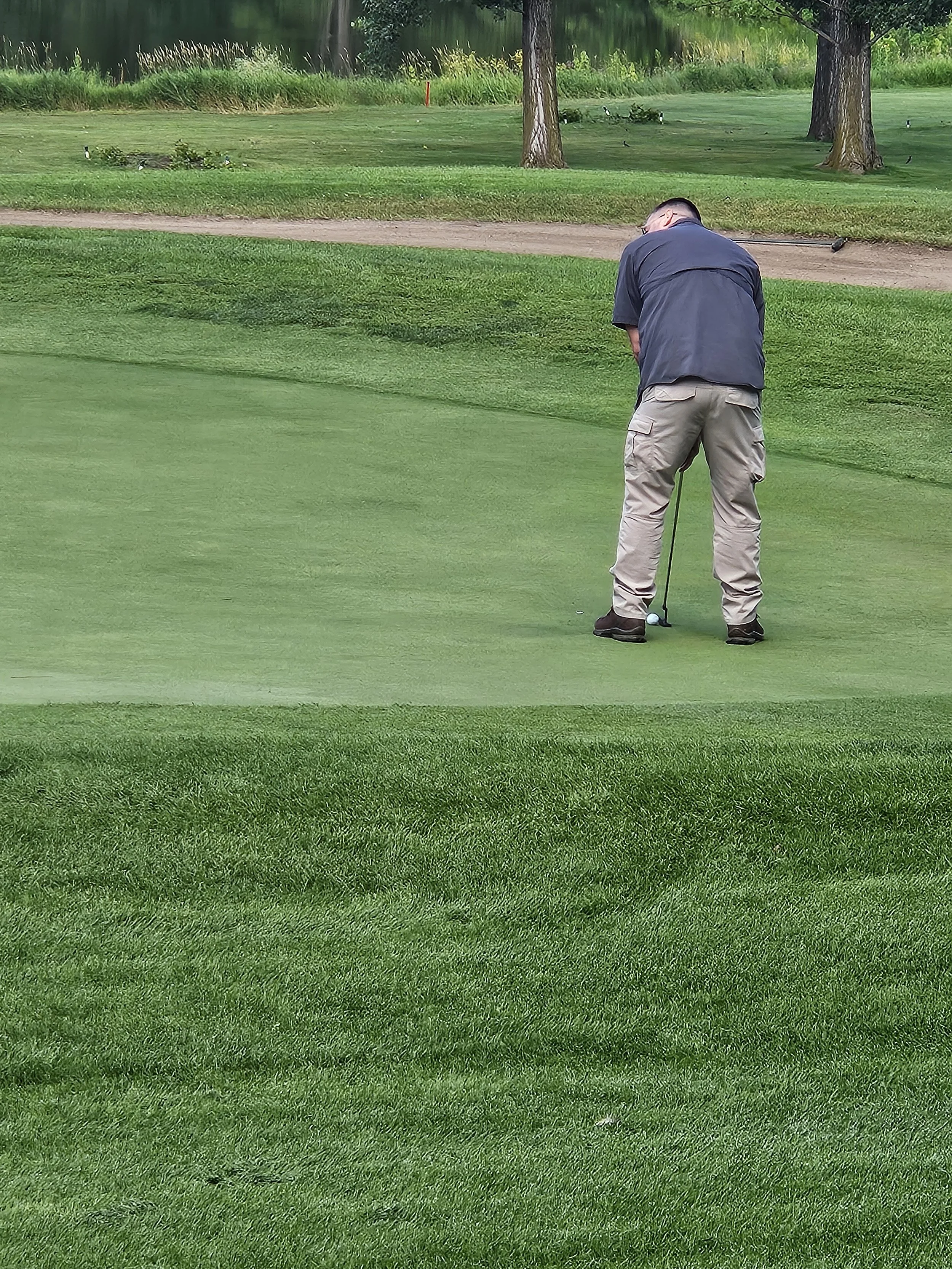 Jason taking his time with a long putt.