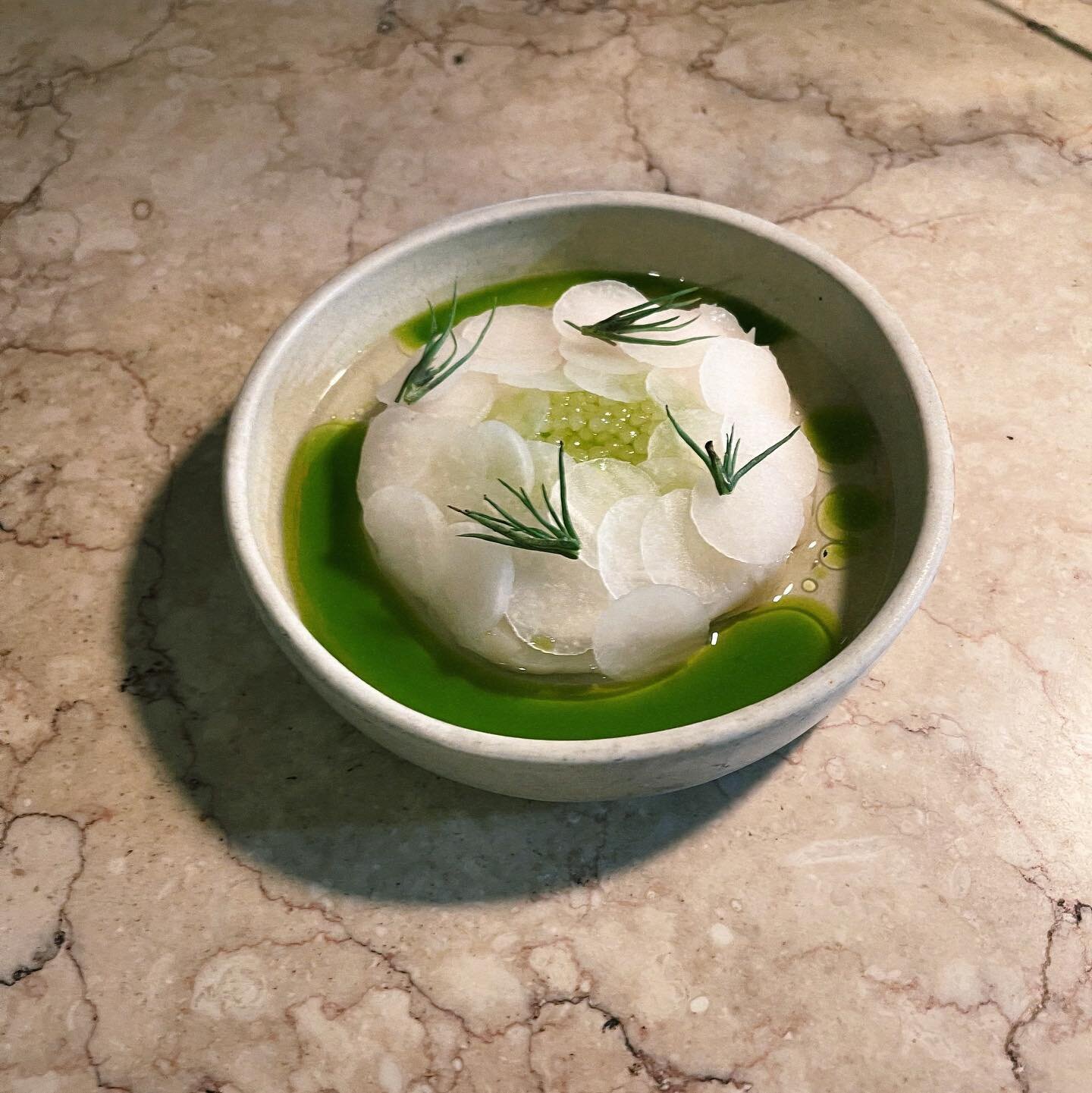 Scallops in cucumber water . Borage oil and grilled agretti .