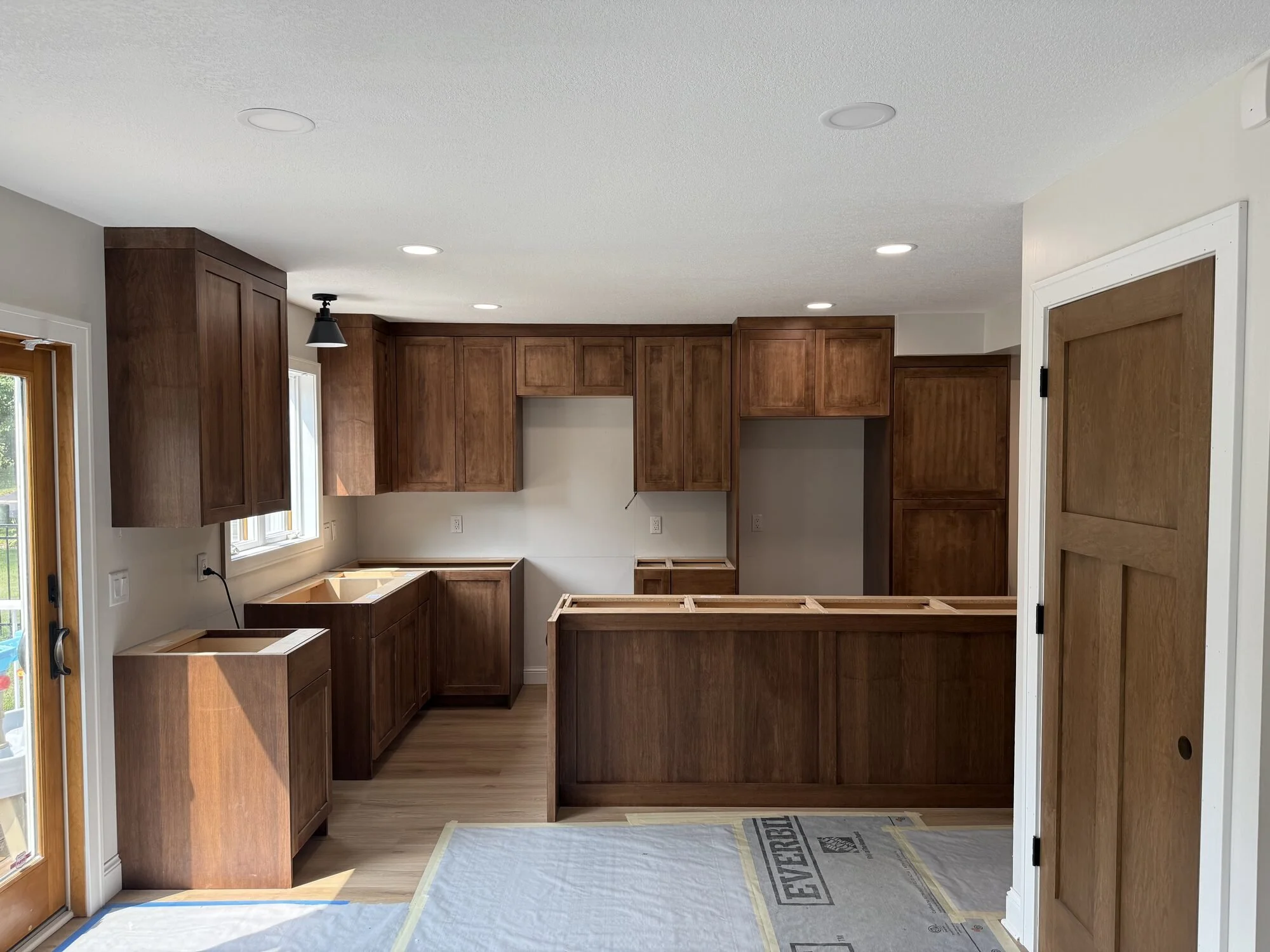 Maple shaker kitchen in a Walnut stain with a drawer-bank island, Lino Lakes, MN