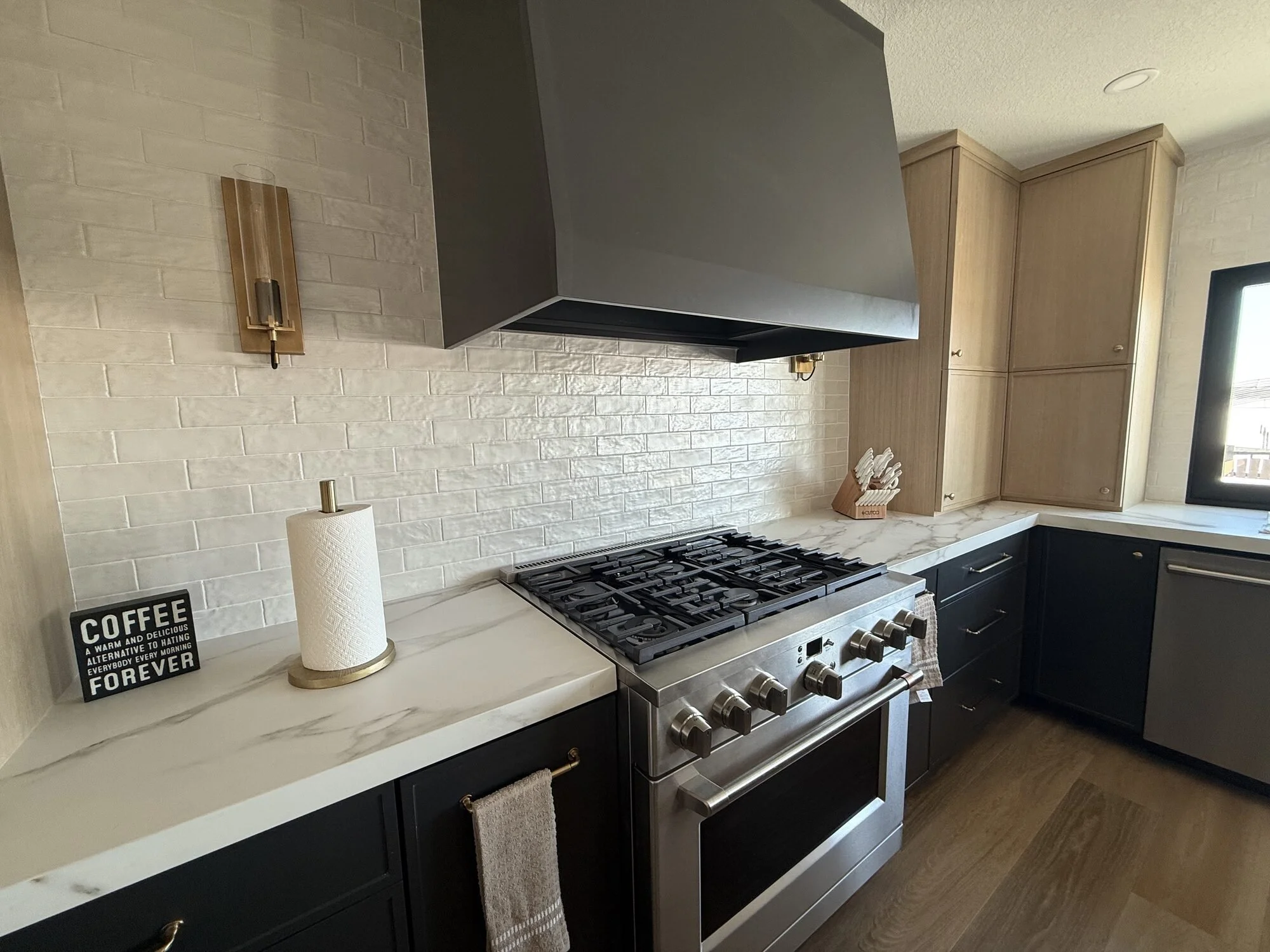 Charcoal shaker base cabinets, white oak uppers and a custom range hood, Chisago Lakes, MN