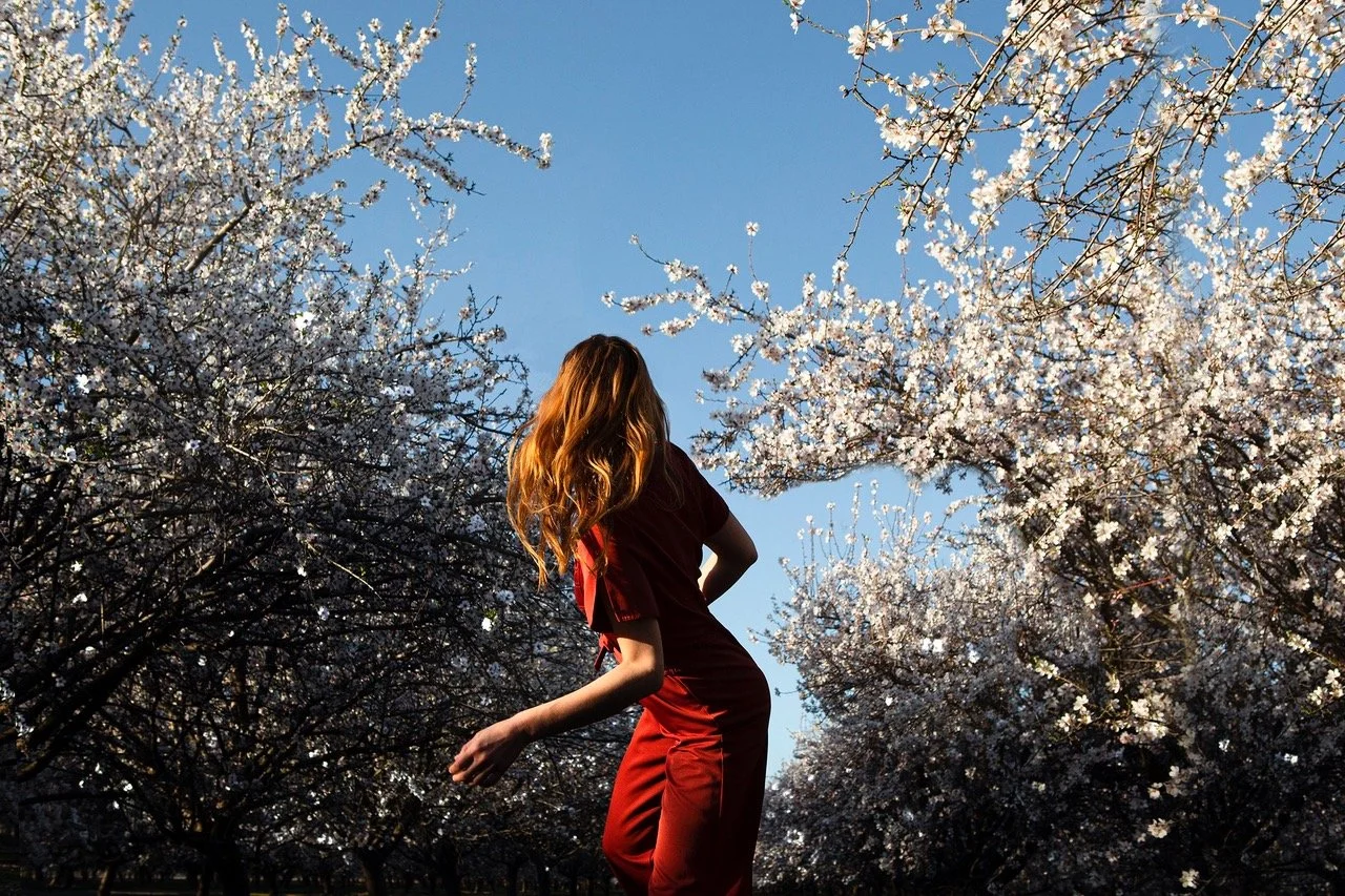 03_MaiaFlore_SFTS2023_Untitled_RedOutfit_Flowers_39x59inches.jpeg