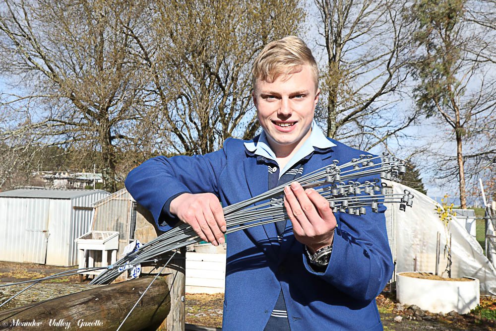 Deloraine High School student, 16 year-old Jayden Lee, pictured with his ‘tie o s’ designed to make rural fencing quicker and easier.