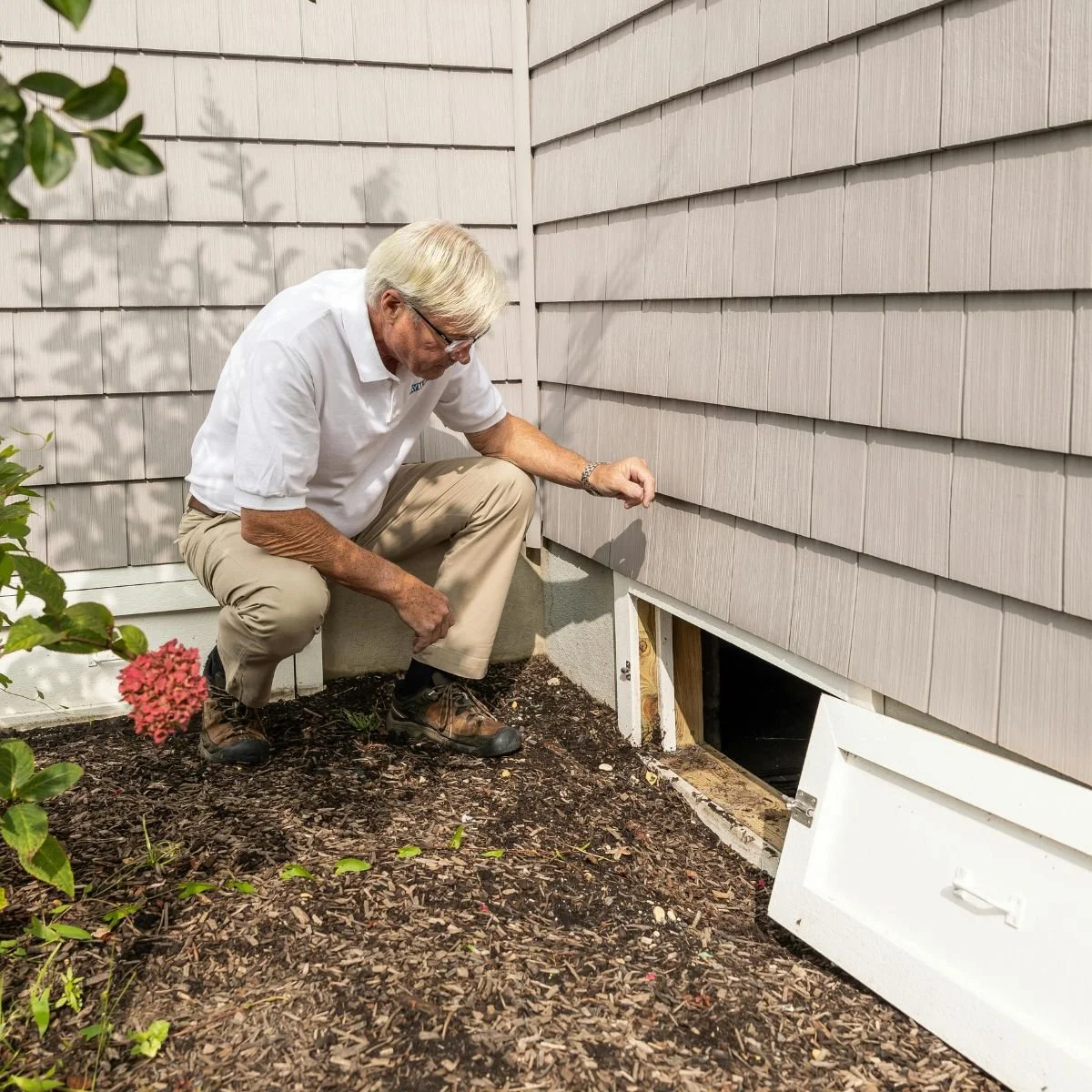 Older man in white shirt and khakis remediating mold Sacramento CA